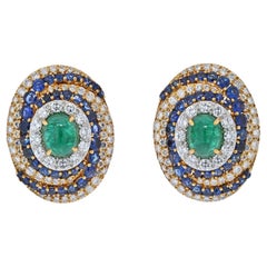 Vintage David Webb Bombe Style Highly Decorated Diamond, Sapphire and Emerald Earrings