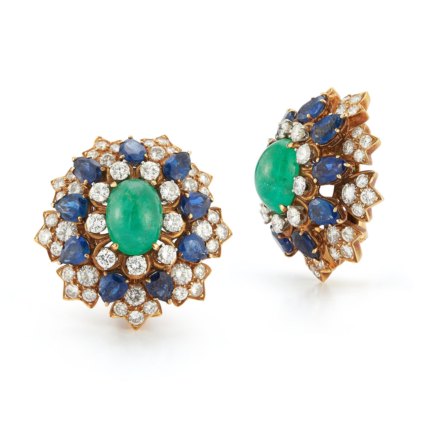 David Webb Cabochon Emerald Sapphire & Diamond Flower Earrings  

Two cabochon emeralds surrounded by round cut diamonds & pear shape sapphires set in 18k yellow gold.

Diamond Weight: approx 5.40 cts 

Measurements: 1.25