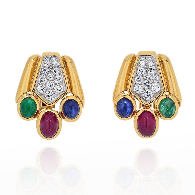 This pair of earclips speaks David Webb in so many ways: traditional choice of color, and gems combination along with the accent diamonds. These ear clips measure about 0.5 inches. 
Diamond carat weight: approx. 0.75cts
Each cabochon: about 5mm.