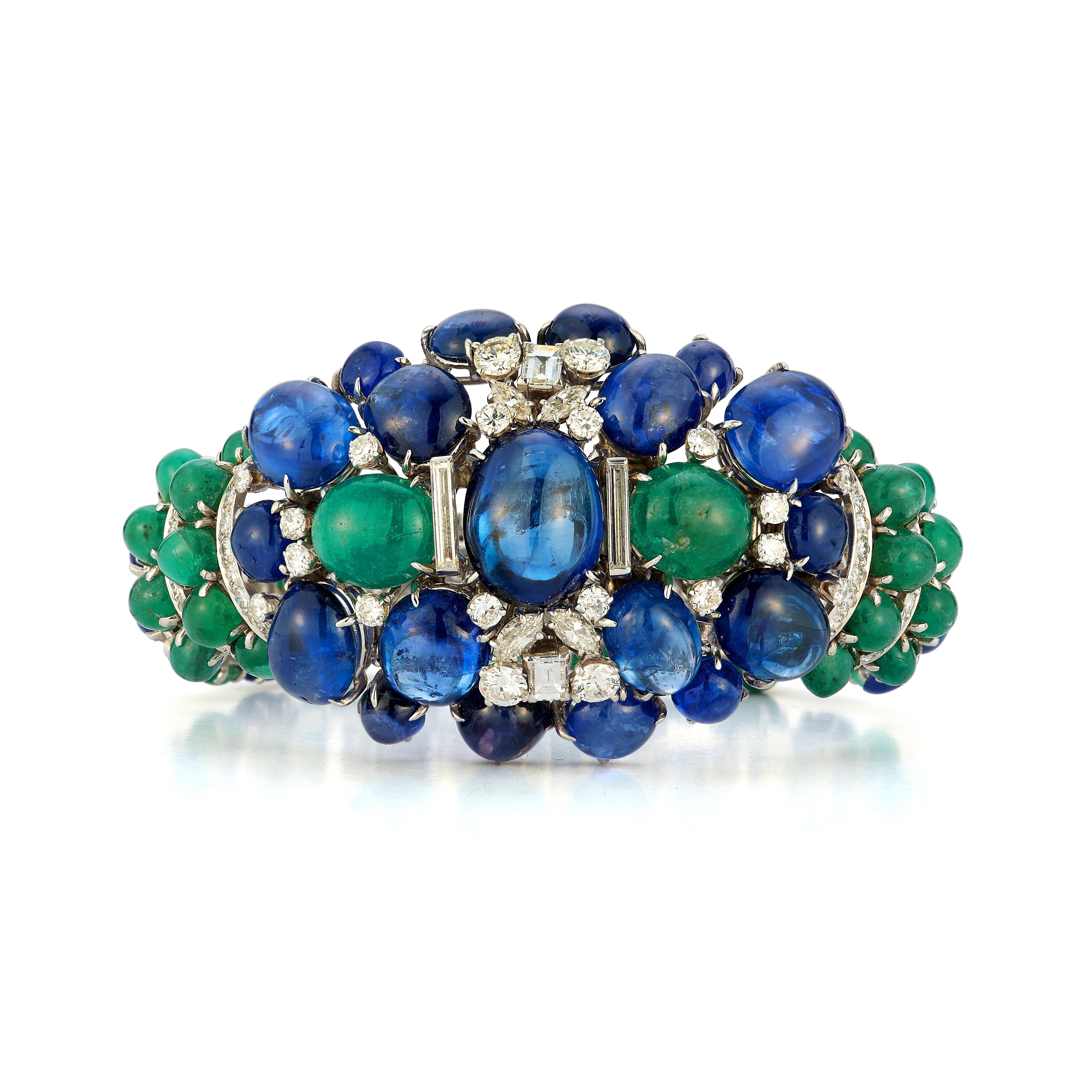 David Webb Cabochon Sapphire & Emerald Bracelet

This beautiful bracelet is made of platinum and 18 karat white gold set with 43 cabochon sapphires, the largest of which is approximately 20 carats, 44 cabochon emeralds, and 179 multi cut
