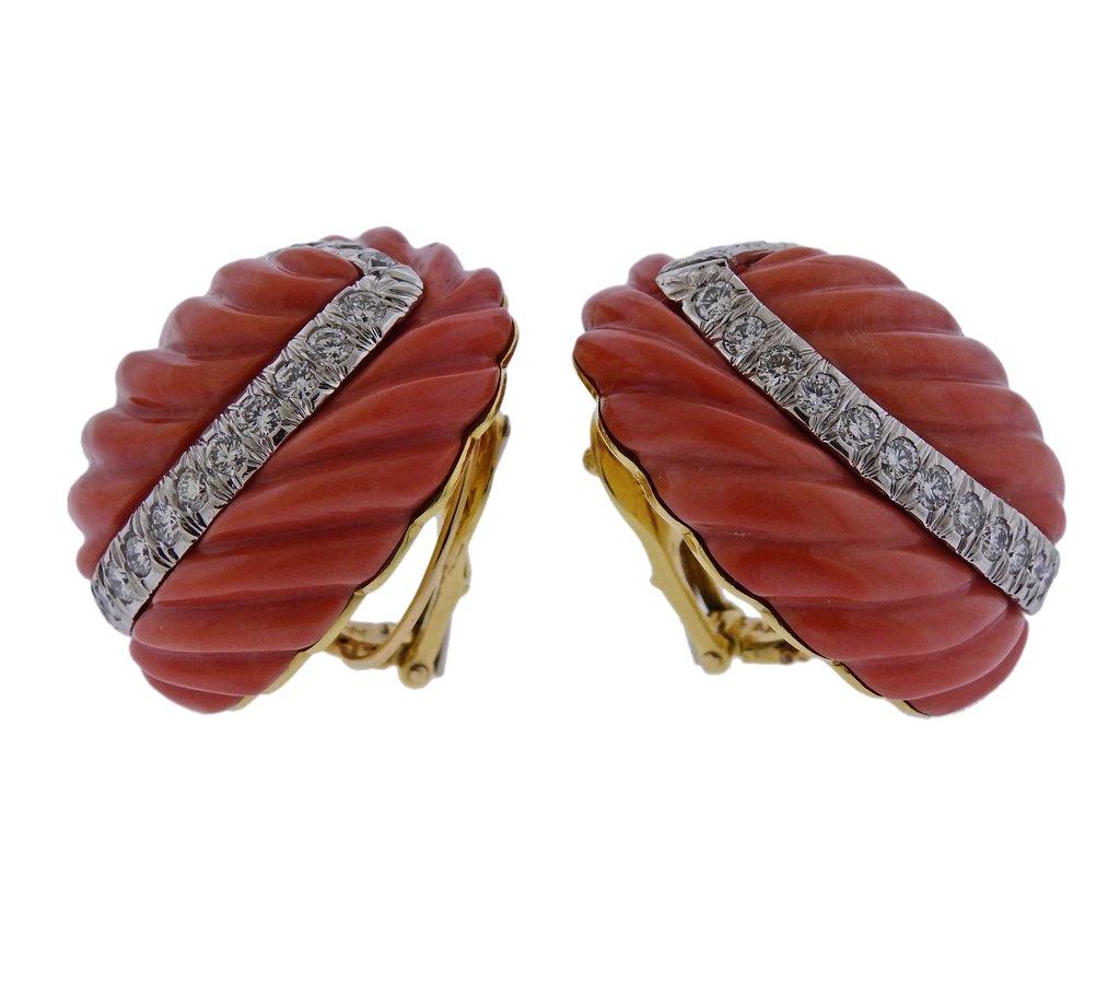 Pair of 18k gold and platinum earrings by David Webb, set with carved coral, surrounded with a total of approx. 3.00ctw in H/VS diamonds. Retail $38000. Earrings are 31mm x 27mm and weigh 62.1 grams. Marked David Webb, 18k, 900pt. 