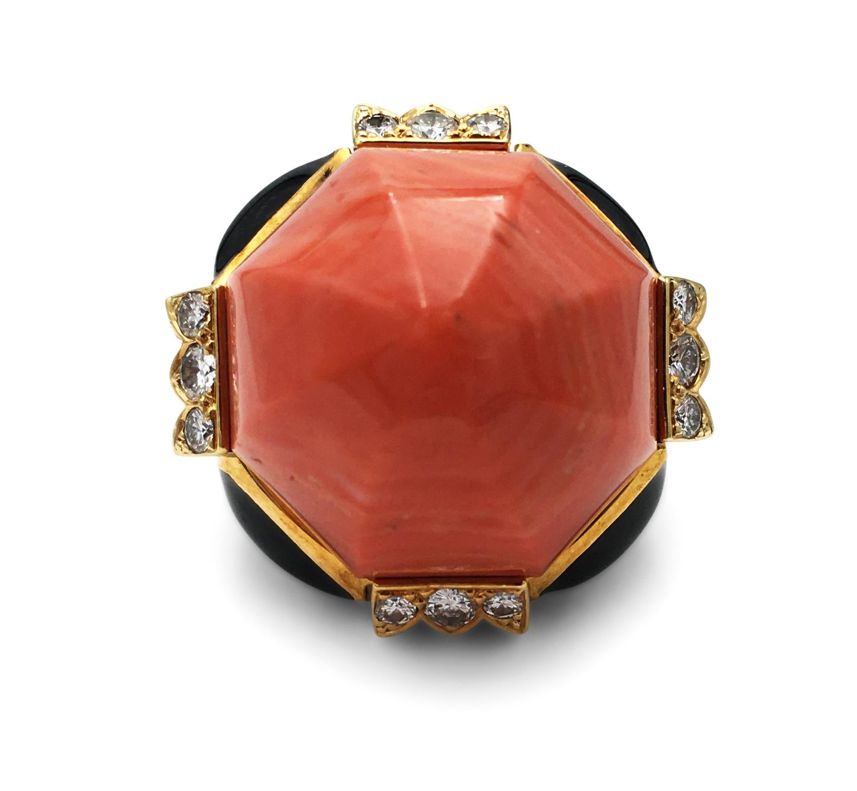 Authentic David Webb cocktail ring centers on a delicious piece of dome shaped carved coral stone flanked by four sections of round cut diamonds weighing an estimated 0.60 carats (E-F color, VS clarity). Contrasting black enamel sections complete