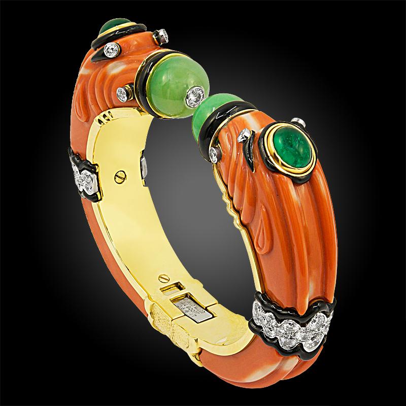 
DAVID WEBB Carved Coral, Jade, Emerald, Diamond Chimera Bracelet
An 18k gold and platinum Two head Chimera bangle, set with diamonds, cabochon emerald, carved coral, black enamel, signed David Webb.
Inner-circumference is approx, 6.5″
Circa 2000
