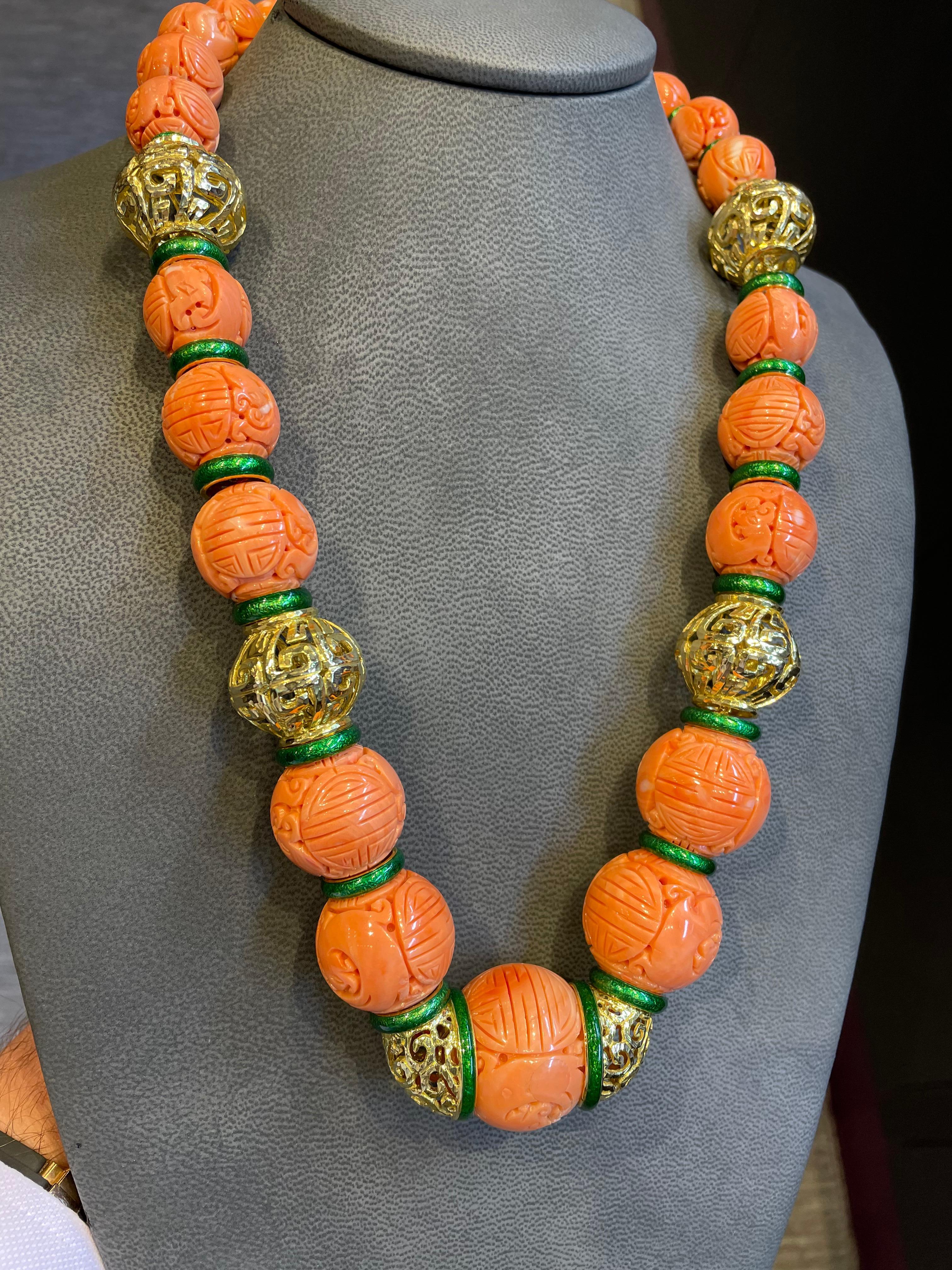 David Webb Carved Coral Necklace,

Set with museum quality large size antique carved Chinese coral beads.

Four sizes of carved coral beads:
Coral beads size:
large-30mm
medium-25mm
small-20mm
xs-17.5mm

18 karat Hammered gold & green enamel