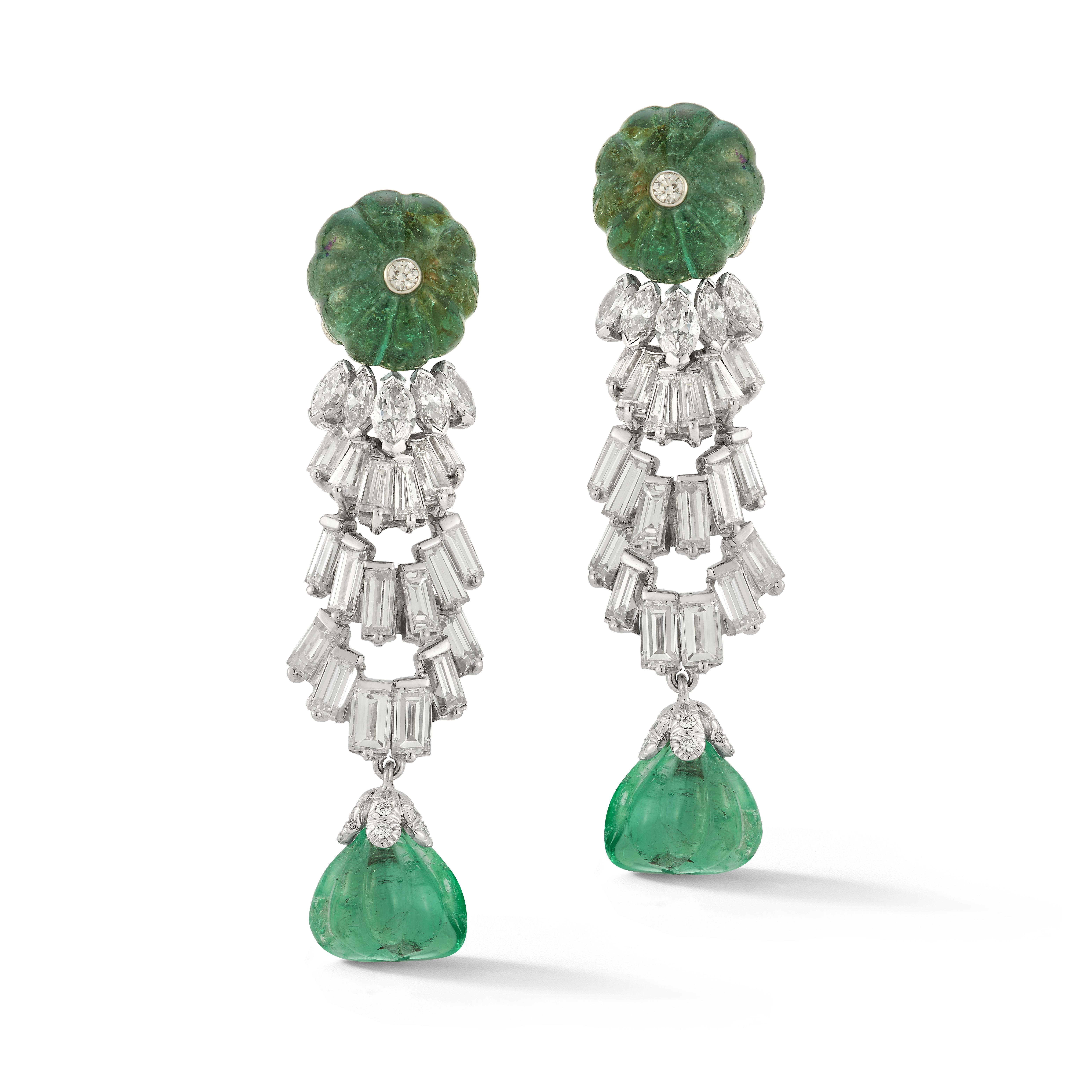 David Webb Carved Emerald & Diamond Earrings

A pair of platinum earrings set with baguette, marquise, and brilliant cut diamonds and approximately 31.35 carats of carved emeralds

Accompanied by a David Webb certificate of authenticity

Signed Webb