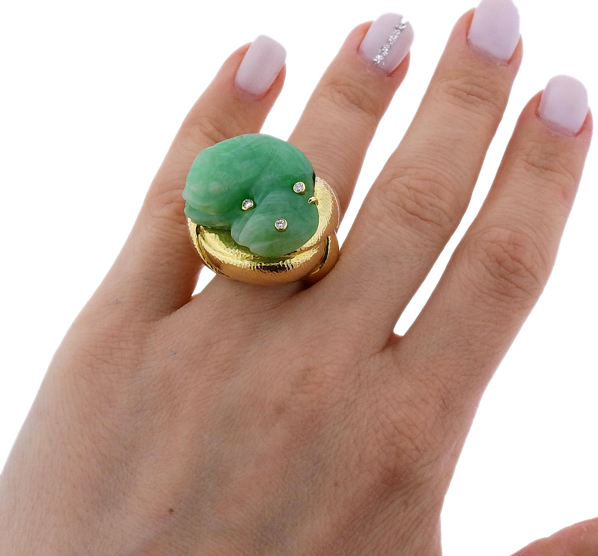 Impressive 18k yellow gold ring by David Webb, featuring carved jade and approx. 0.16ctw in H/VS-SI diamonds. Ring size - 6, ring top - 26mm x 2mm, sits approx. 23mm from the finger. Marked: Webb, 18k. Weighs 39.6 grams.