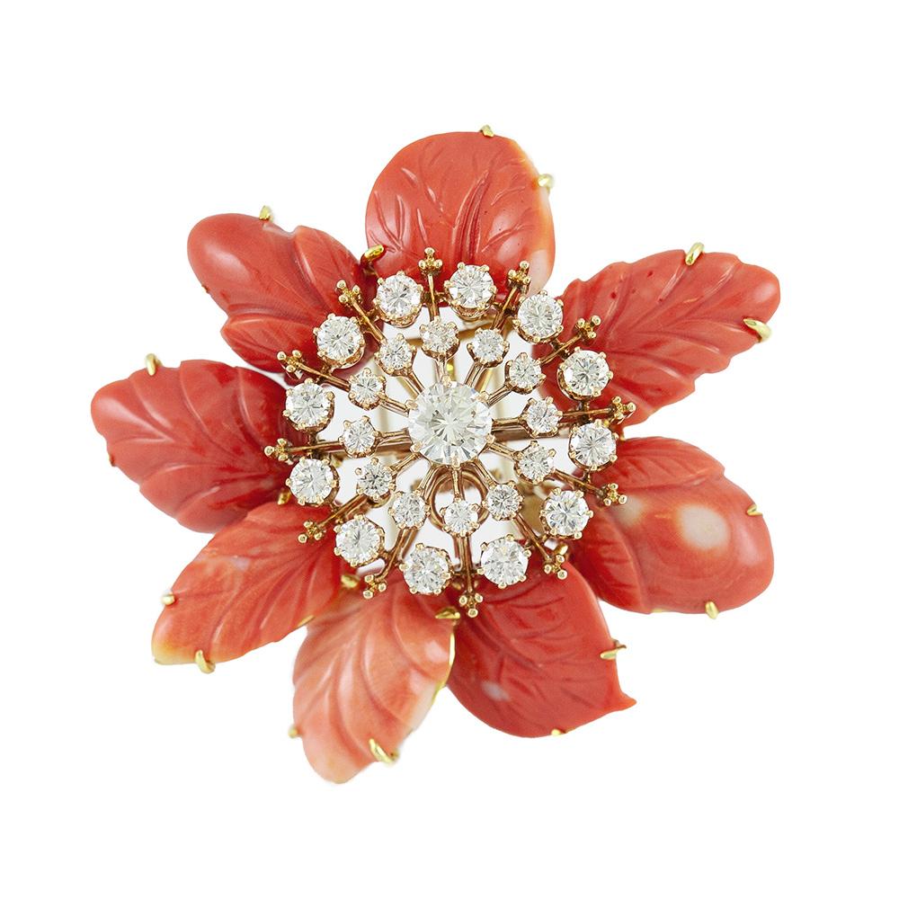 Finely crafted in 18k yellow gold with carved corals and round cut diamonds. 
The center diamond weighs approximately 1.05 carats while surrounding smaller diamonds weigh approximately a total of 4.00 carats.
Signed by David Webb.
Circa
