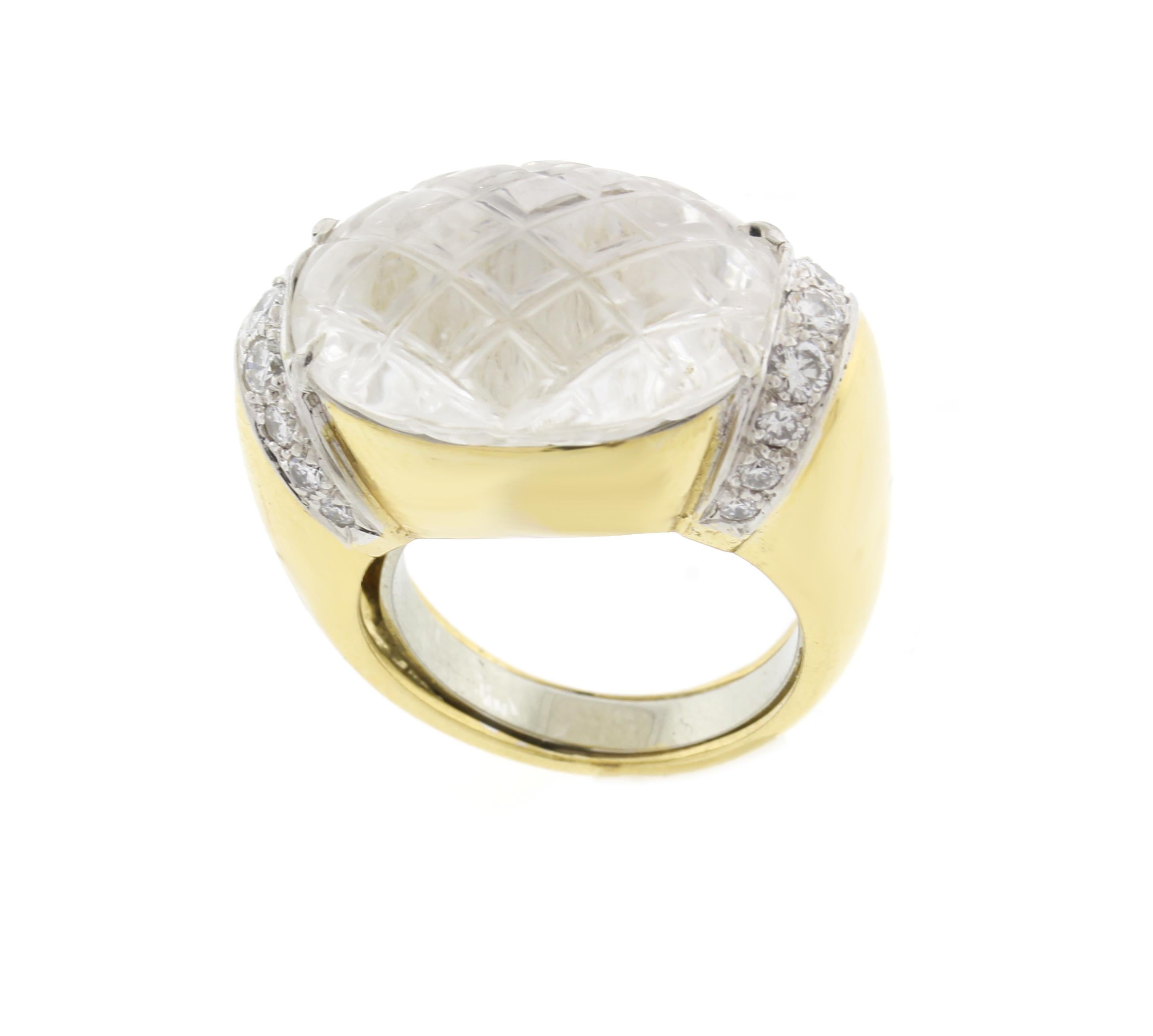 From David Webb a carved Crystal and diamond ring
♦ Designer: Davis Webb
♦ Metal: 18 karat and platinum
♦ Circa 1980s
♦ Rock Crystal 14 X 19mm
♦ 518Dia=.63 carats
♦ Packaging: Pampillonia presentation box
♦ Condition: Very Good , pre-owned
♦ Price: