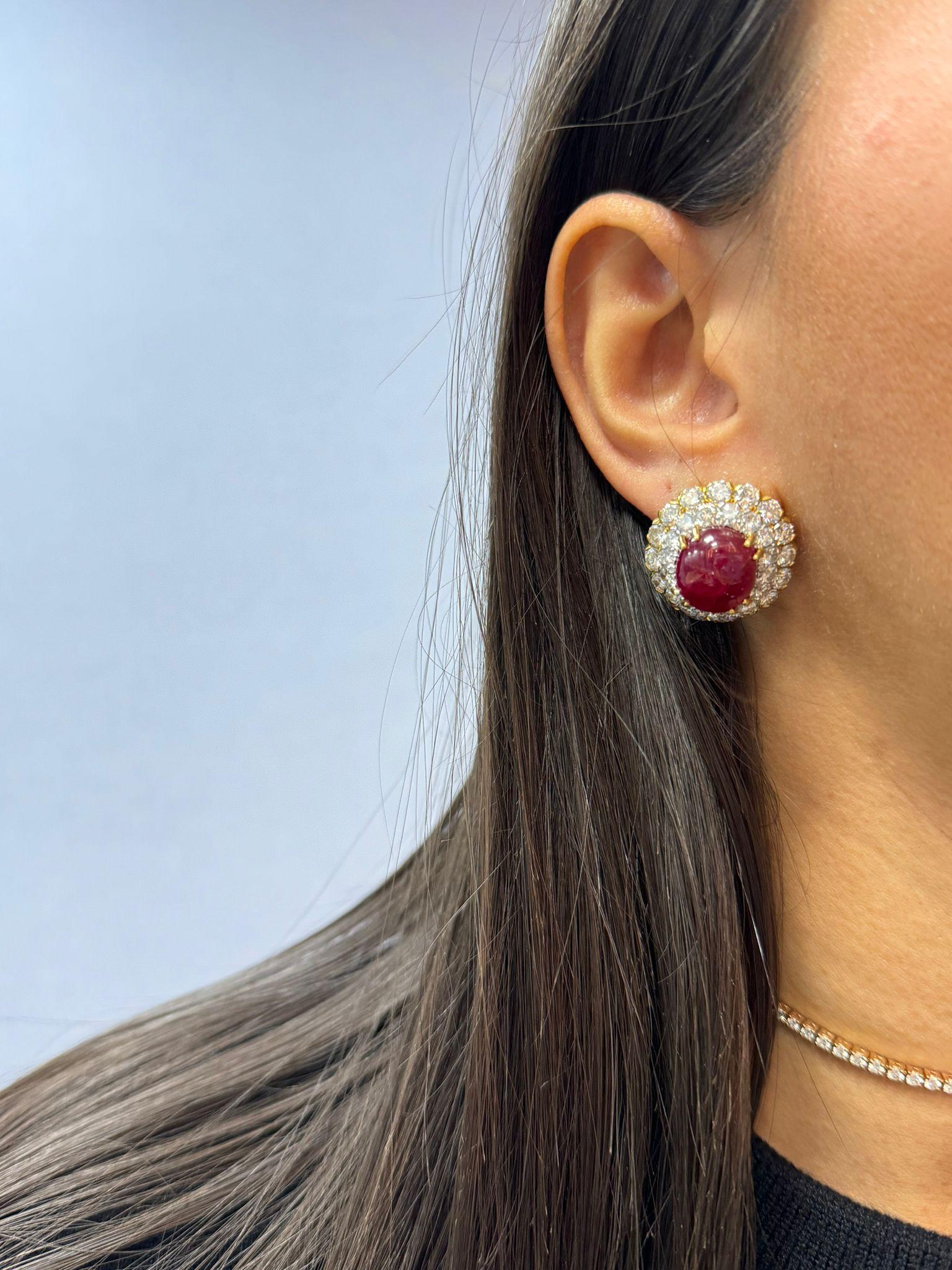 Experience the luxurious allure of these David Webb earrings, a stunning example of exceptional craftsmanship and exquisite gemstones. Crafted from a combination of platinum and 18 karat gold, each earring features two magnificent unheated Burmese