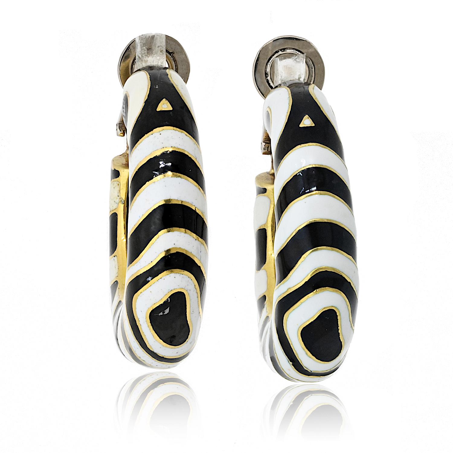 **David Webb Platinum & 18K Yellow Gold Zebra Hoop Earrings**  

A bold and exotic statement, these David Webb Zebra Hoop Earrings capture the brand’s distinctive flair for design. Expertly crafted in a combination of platinum and 18K yellow gold,