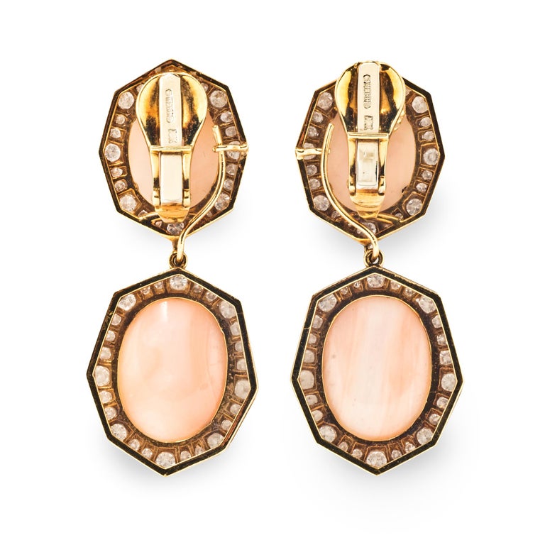 Prized for centuries for its natural beauty and delicate color, Angel Skin coral belongs to a rare group of extraordinary gems. In these vintage David Webb ear clips, oval cabochon coral is framed by octagonal collars of brilliant cut diamonds. The