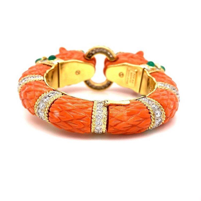 Double Head Lion BANGLE BRACELET, BY DAVID WEBB

An important example of David Webb's design, a carved coral bangle bracelet.   Designed in David Webb's celebrated and signature animal motif, the bracelet   features two dragon heads whereby each is