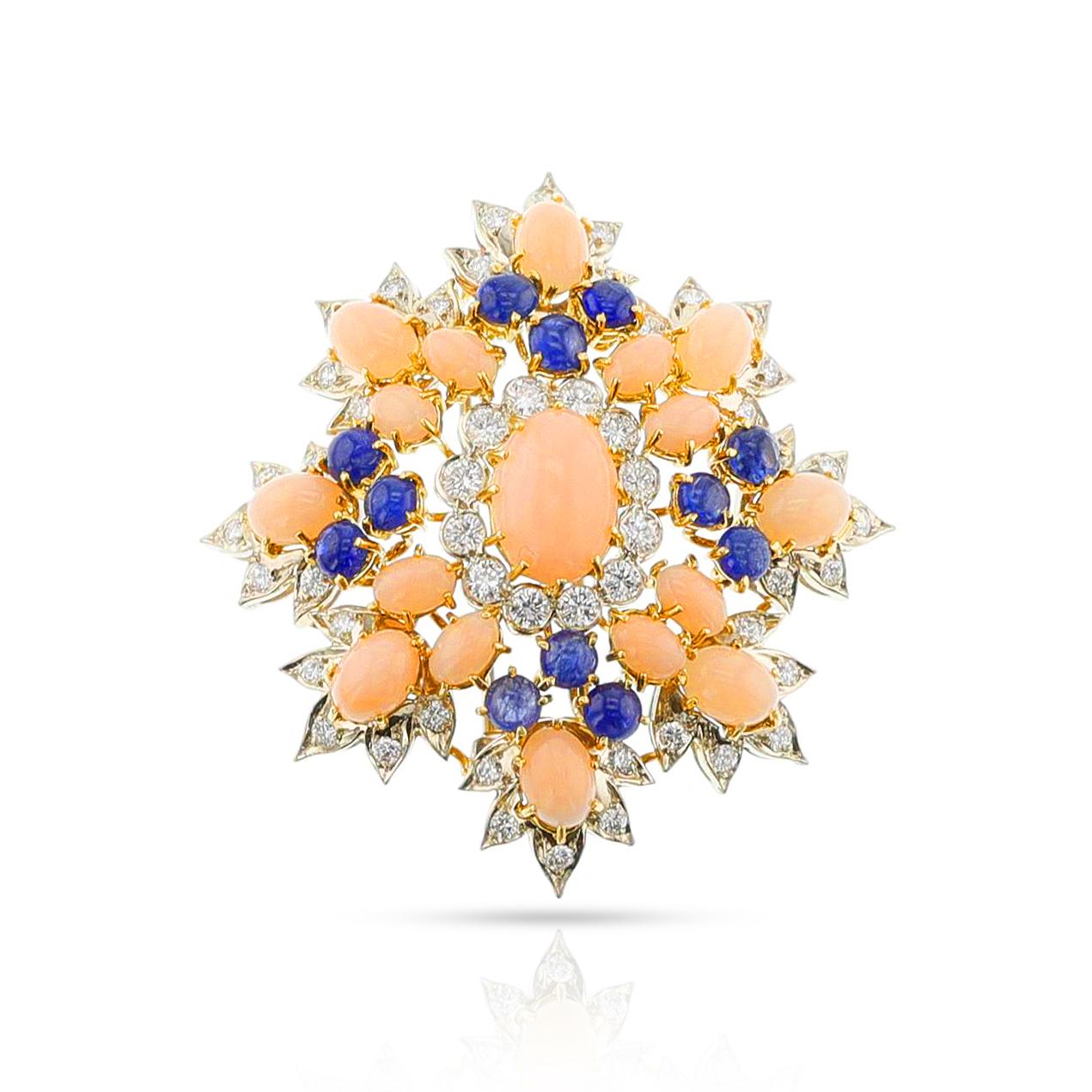 A gorgeous David Webb Coral, Sapphire and Diamond Brooch crafted from Gold & Platinum. This timeless statement piece displays stunning craftsmanship and attention to detail that will last through generations. The total weight is 30.40