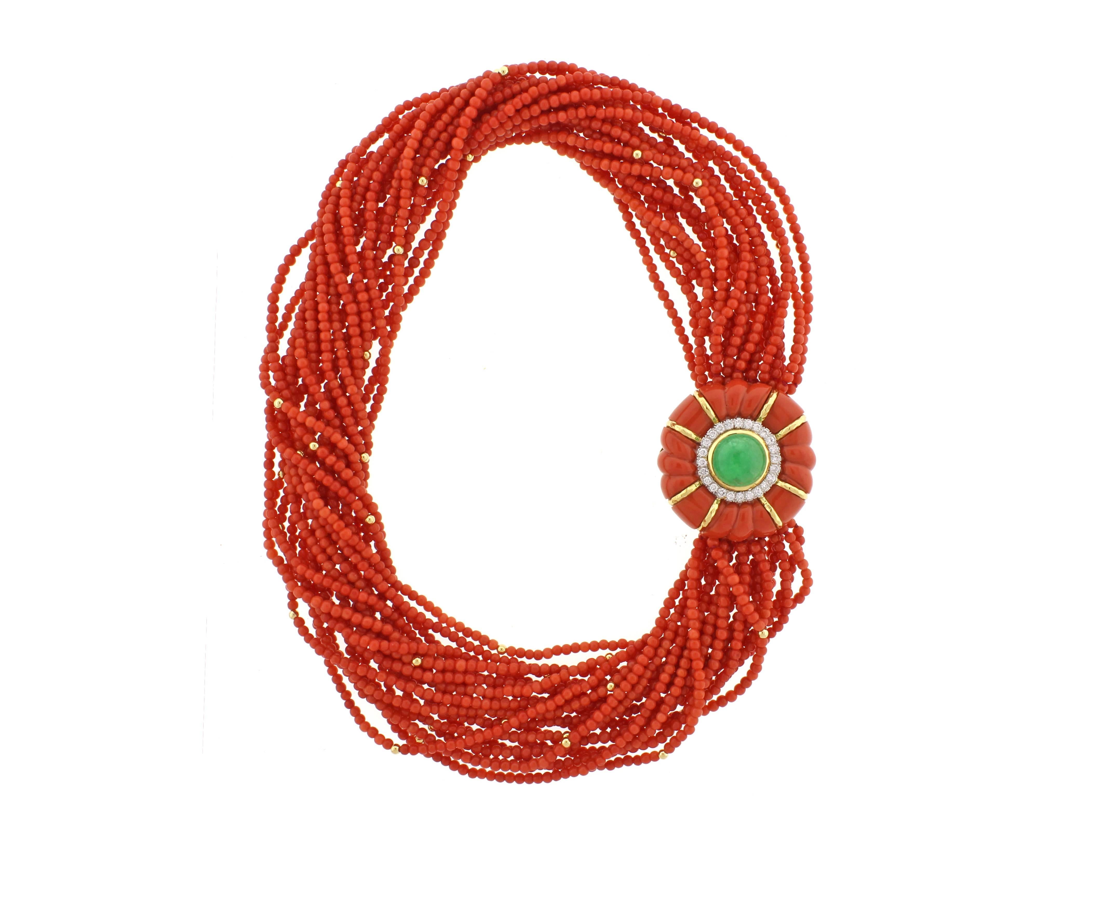 From David Webb, a very rare torsade of 3.5mm deep salmon coral necklace. The carol, diamond and emerald clasp boasts  24 brilliant diamonds weighing 2.40 carat and a 14mm cabochon emerald.   The clasp measures 45mm across, neck 17-20 inches