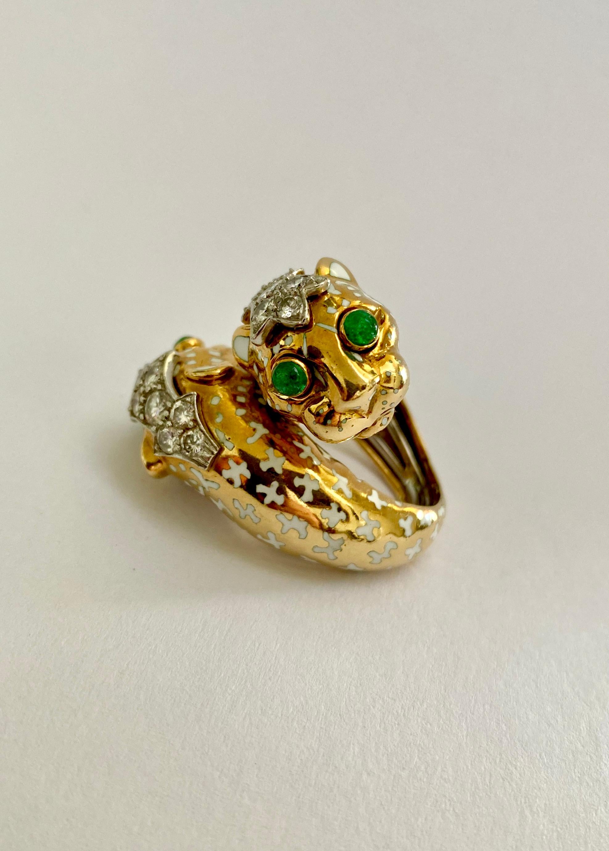 David Webb was known for his animals and this ring has all of his signature touches.  White enamel spots, bright green cabochon emerald eyes and just the sparkle of diamonds make this an iconic Webb design.  This particular ring goes all the way