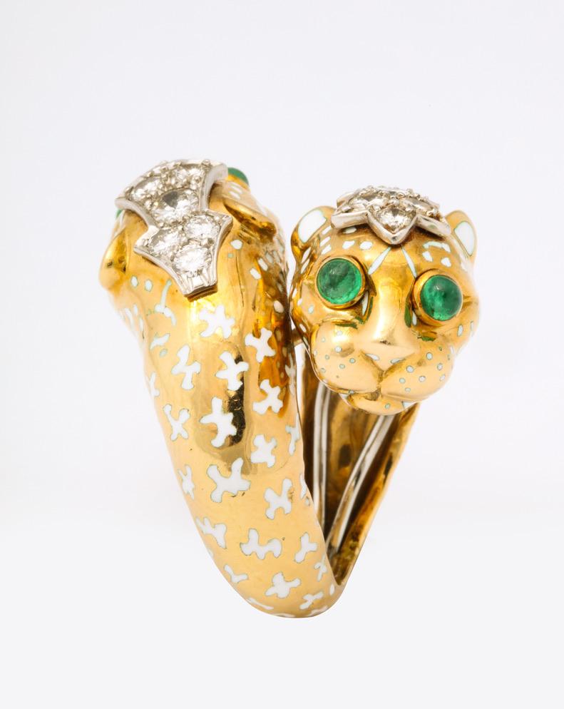 David Webb was known for his animals and this ring has all of the signature touches.  White enamel spots, bright green cabochon emerald eyes and just the right sparkle of diamonds make this an iconic Webb design.  This particular ring goes all the