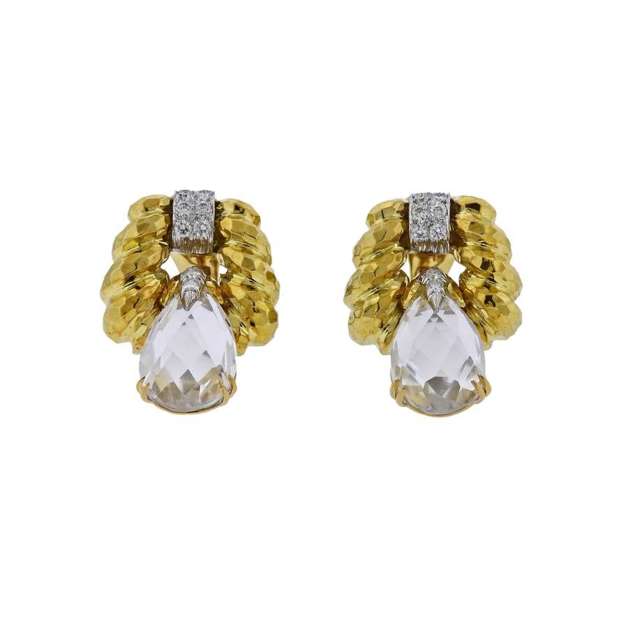 Impressive 18k hammered gold and platinum doorknocker earrings, crafted by David Webb, set with faceted crystals and approx. 0.76ctw in H/VS diamonds.  Earrings are 34mm x 23mm and weigh 32.6 grams. Marked David Webb, 18k,900PT. 