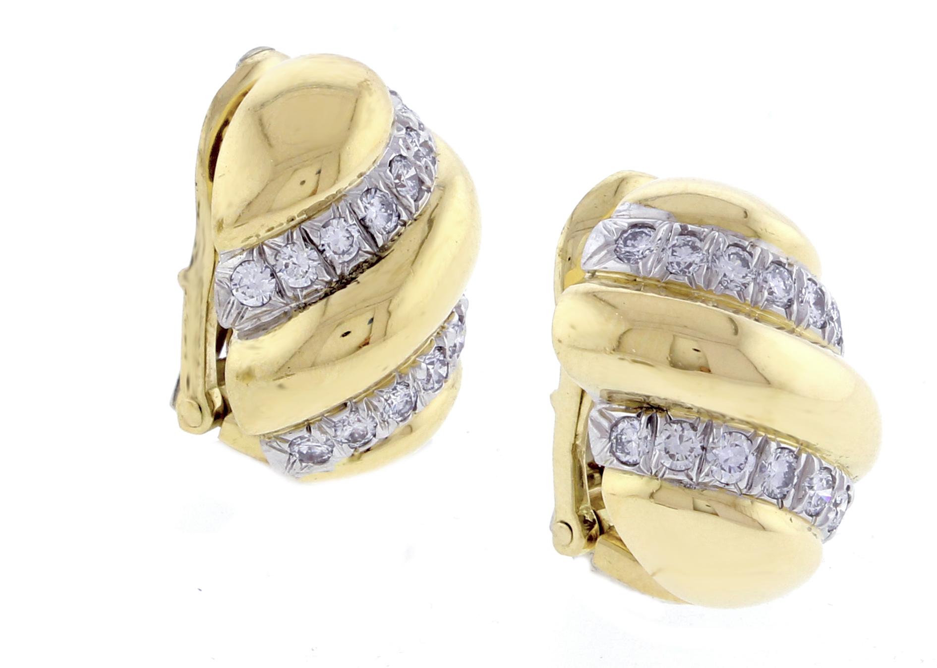 From David Webb, a pair of diamond and  18 karat  gold and platinum earrings. The earrings feature 32 brilliant diamonds weighing approximately  1.25 carat. The earrings measure  high and  ¾ and ½ wide.
