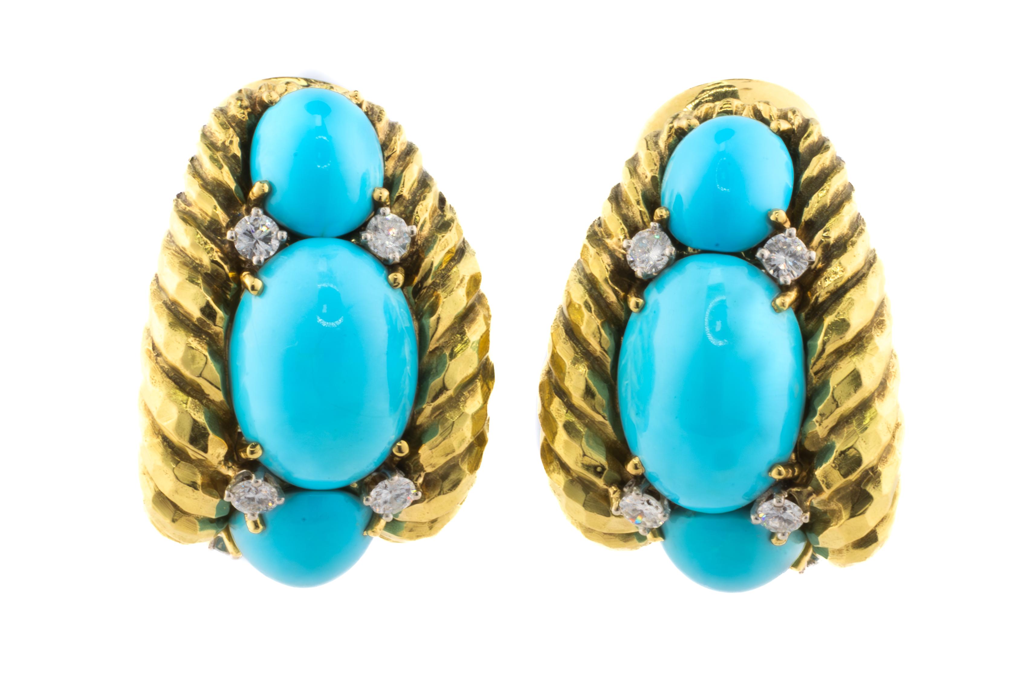 David Webb Diamond and Turquoise Gold Earrings

Description:
Striking and bold, these vintage earrings by David Webb showcase the designer’s signature use of vibrant color and sculptural form. Each earring features three cabochon turquoise stones