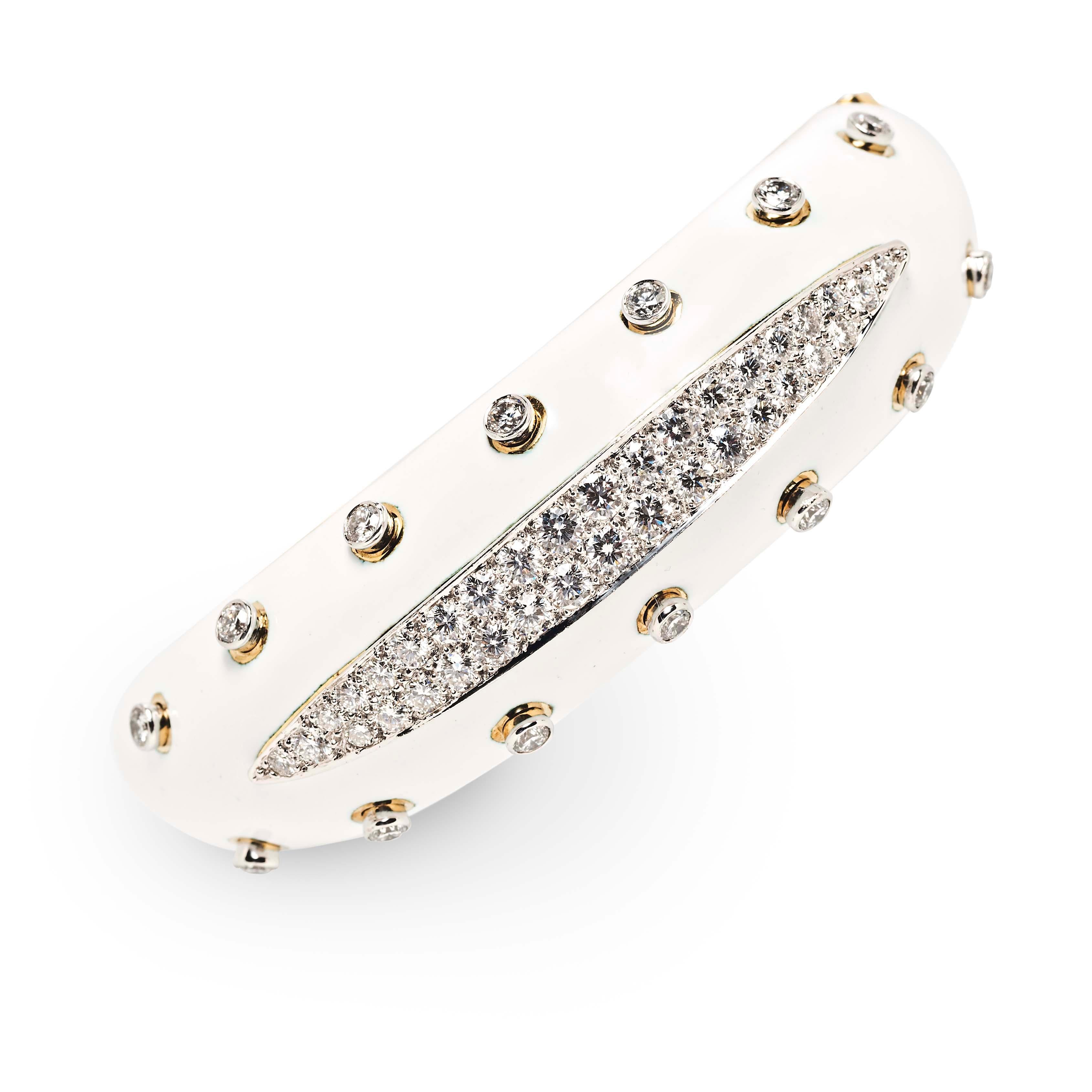 Designed for a double take, the Slice Cuff from David Webb is the ultimate combination of classic chic and full-blown glamour. A grooved line of pavé-set diamonds, highlighted by diamond collet studs, is set on a ground of white enamel. Closing with