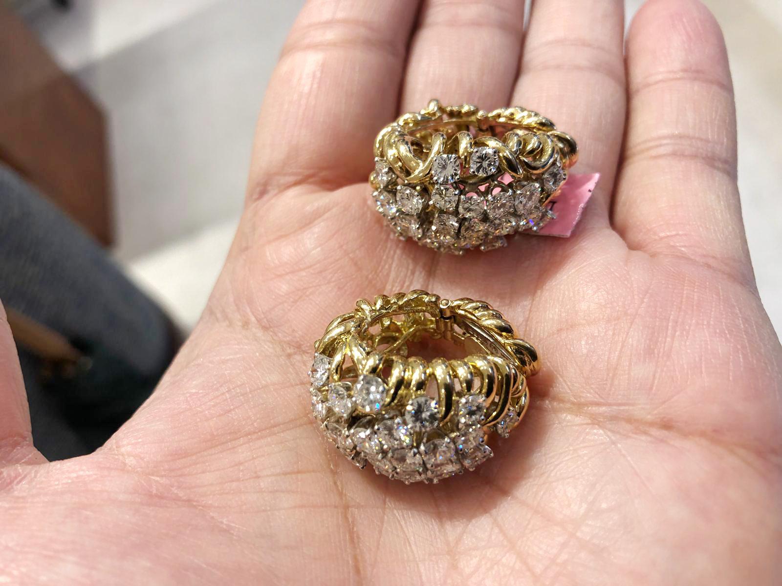 A sublime pair of David Webb earrings of bombe design, set with luminous round cut diamonds weighing approximately 8.20 carats, finely mounted in 18k yellow gold and platinum.
Signed David Webb. Circa 1980s.

Condition: Good - Previously owned and