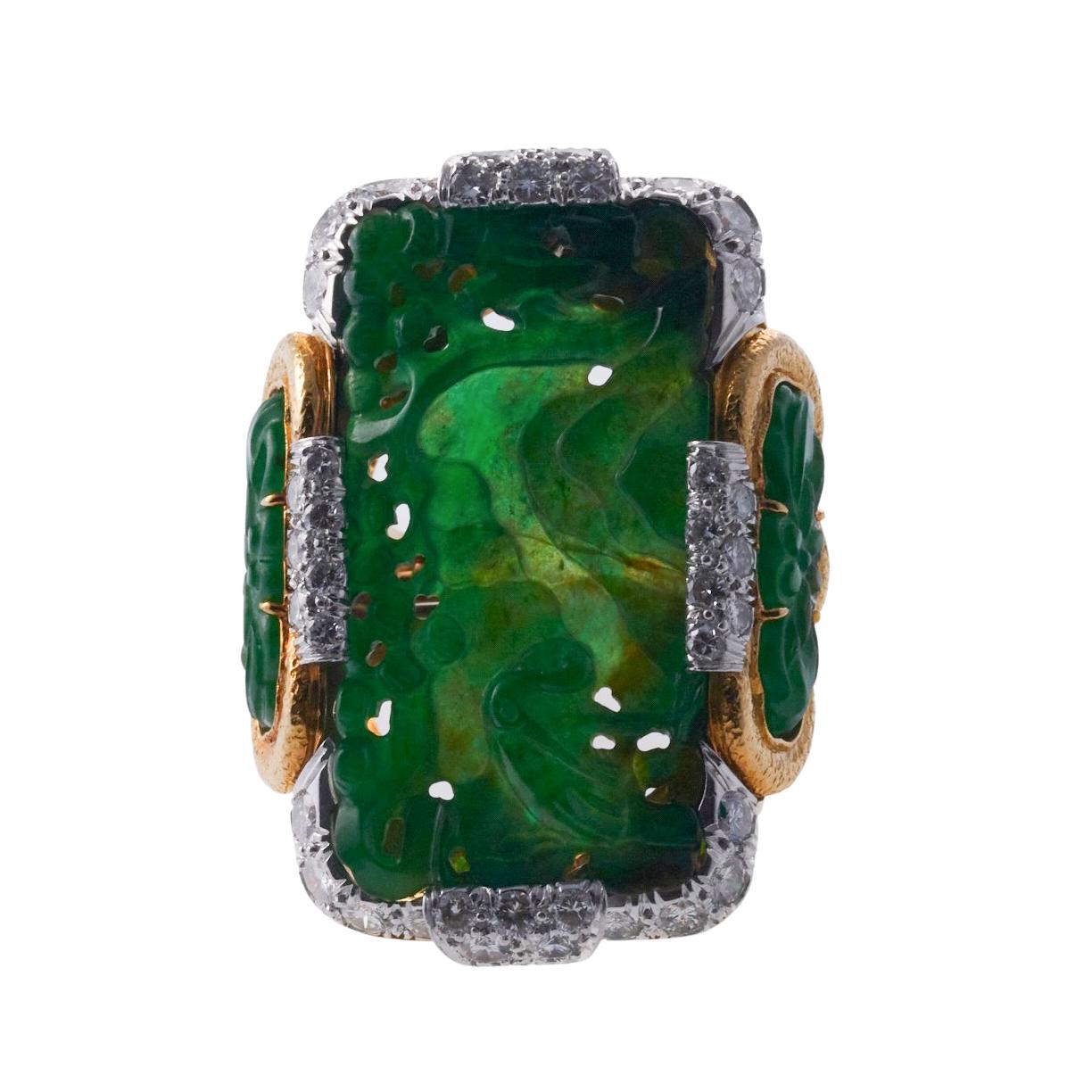 Vintage 18k gold and platinum ring by David Webb, set with carved jade and approx. 2.50ctw in VS-SI/H diamonds. Ring size 6-7 (with ring guard), top measures 38mm x 27mm. Marked: Webb, 18k, .plat. Weight is 37.2 grams. 