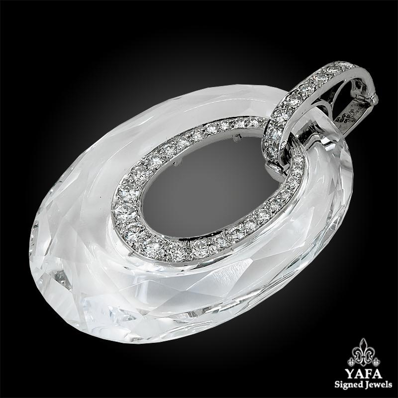 A platinum and 18k white gold pendant, set with carved rock crystal and diamonds signed David Webb.

Measures approx. 2.0