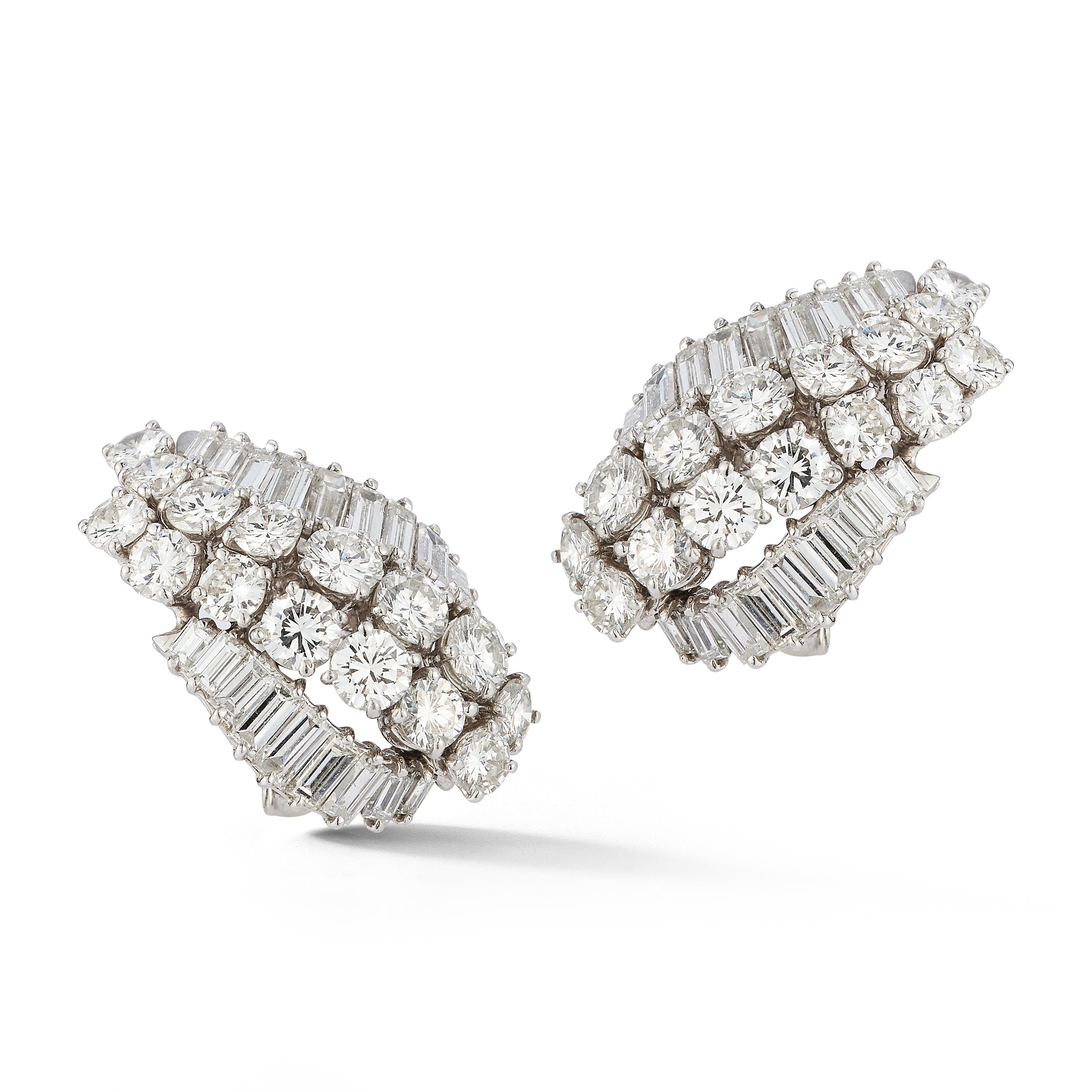 David Webb Diamond Earrings

A pair of platinum and 18 karat white gold earrings set with round cut and baguette cut diamonds

Signed Webb
Stamped 18k & platinum

Total Approximate Diamond Weight: 5 - 6 carats

Metal Type: Platinum & 18 karat white