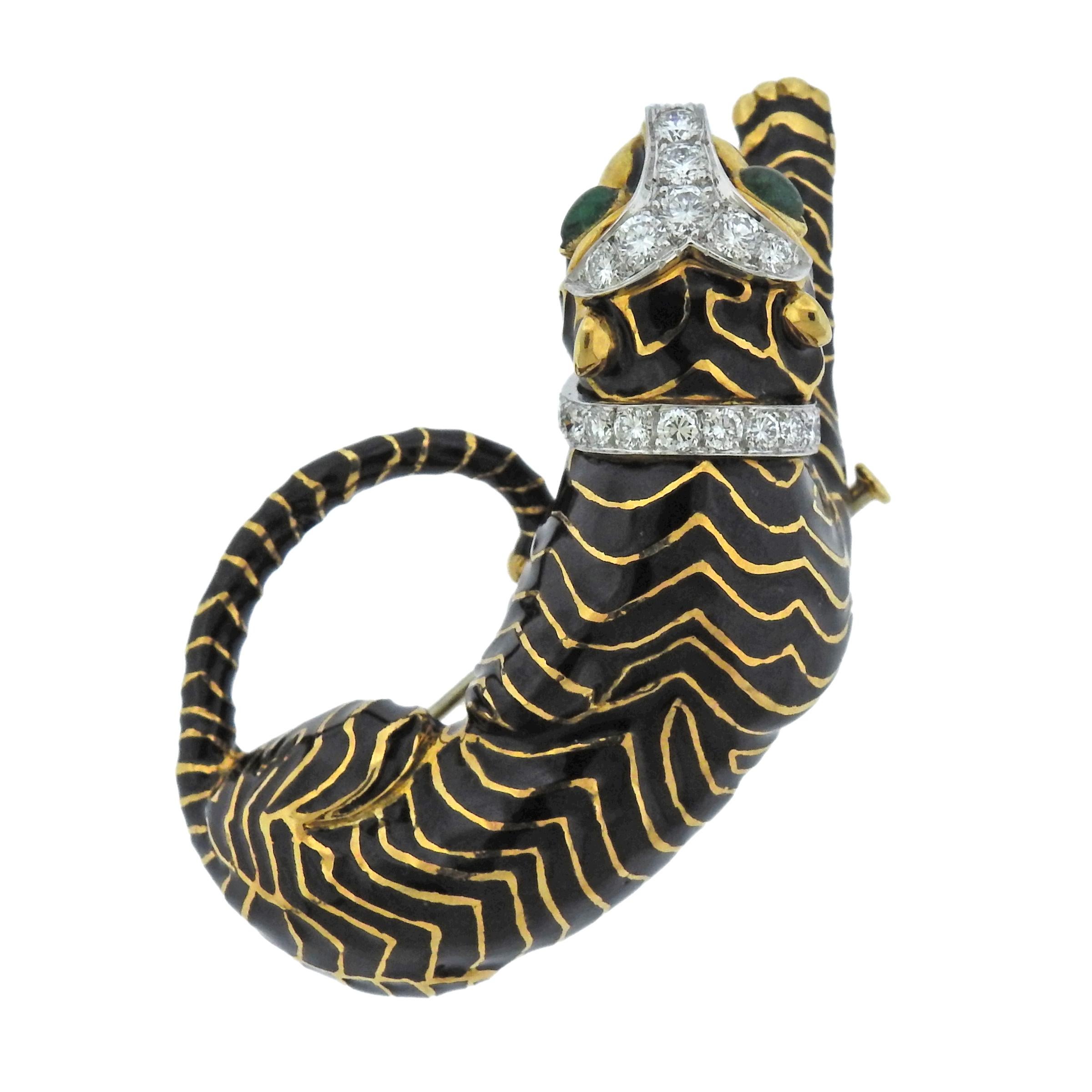 Rare 18k gold and platinum tiger brooch, crafted by David Webb, decorated with black enamel, adorned with approx. 1.20ctw in H/VS diamonds and emerald eyes. Brooch measures 55mm X 38mm, Marked 18k Webb Plat, weighs 48.4 grams.