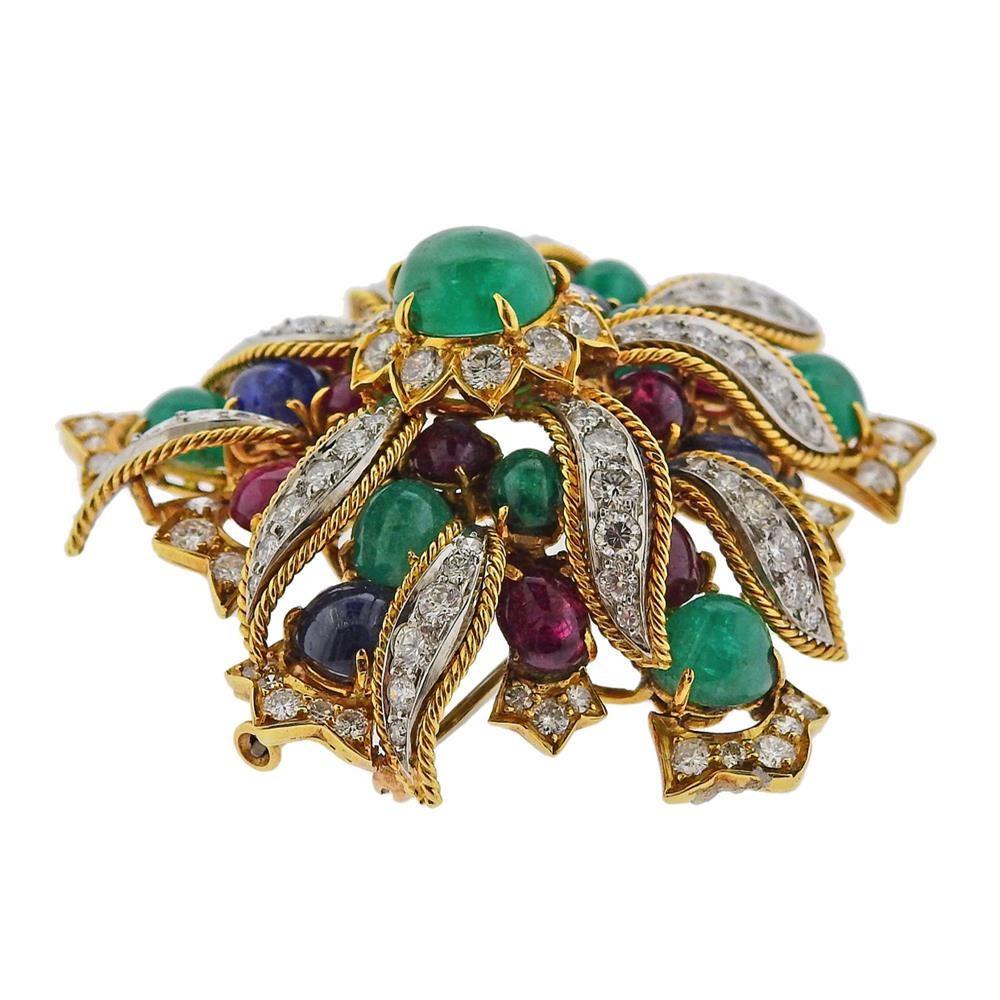 Impressive 18k gold and platinum brooch by David Webb, set with ruby, sapphire and emerald cabochons, and approx. 5.25ctw in diamonds. Brooch is 50mm x 53mm. Marked: Webb 18k, Plat. weight - 38.2 grams.PB-02201