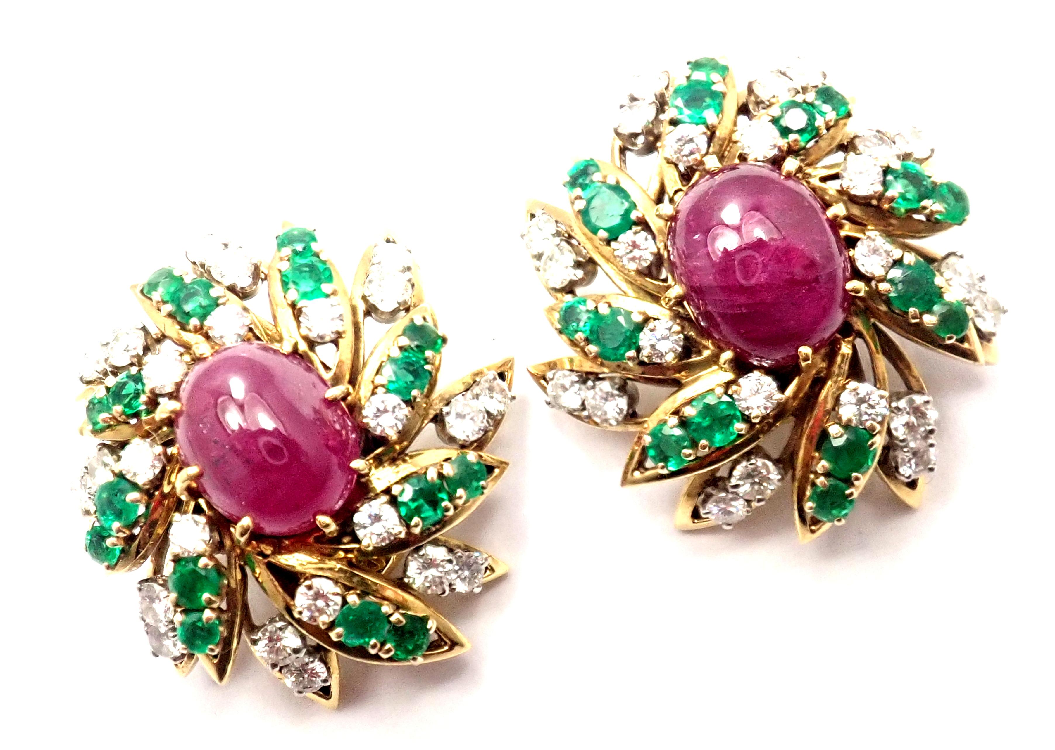 18k Yellow Gold And Platinum Large Oval Rubies, Diamond and Emerald Earrings by David Webb.
With Round brilliant cut diamonds VS1 clarity, G color total weight approx. 3ct
Emeralds total weight approx. 1.4ct
2 oval rubies total weight approx.