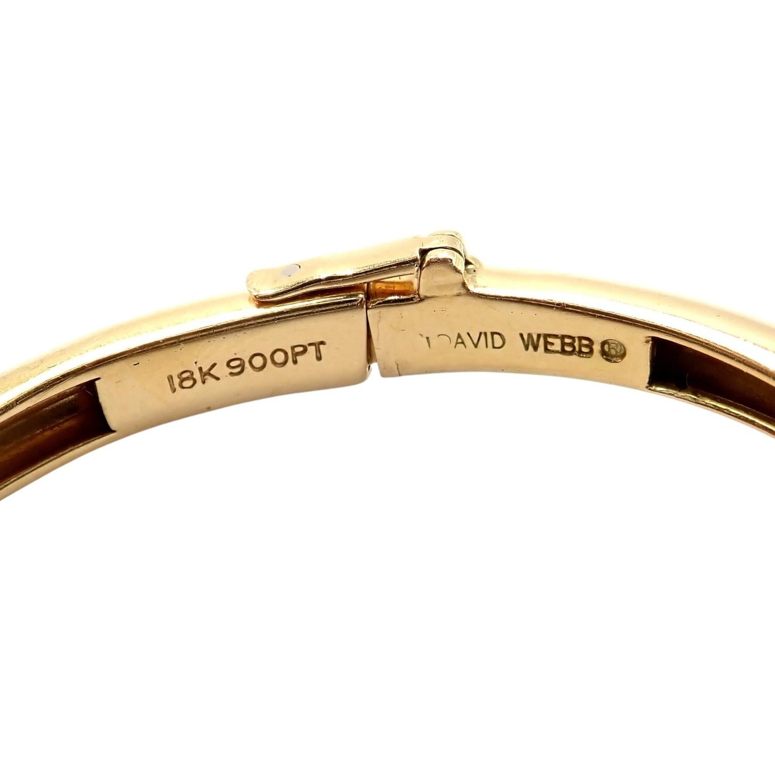 18k Yellow Gold And Platinum Diamond Black Enamel Bangle Bracelet by David Webb. 
This authentic vintage David Webb bangle bracelet features a bold design in 18k gold and platinum, accented with brilliant diamonds and striking black enamel. 
A true