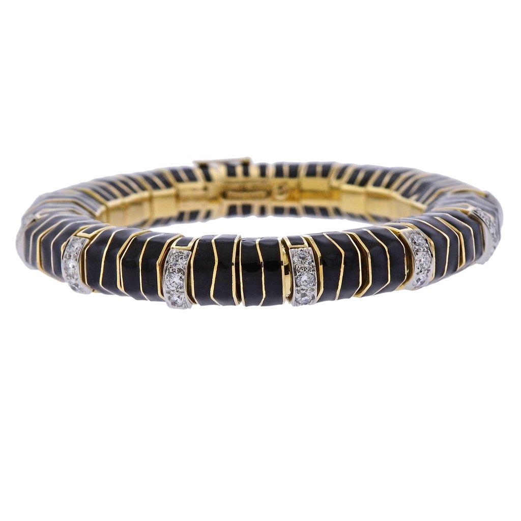 18k gold and platinum black enamel bracelet, crafted by David Webb, adorned with approx.2.75ctw in H/VS diamonds. Retail $49000. Bracelet is 7.75