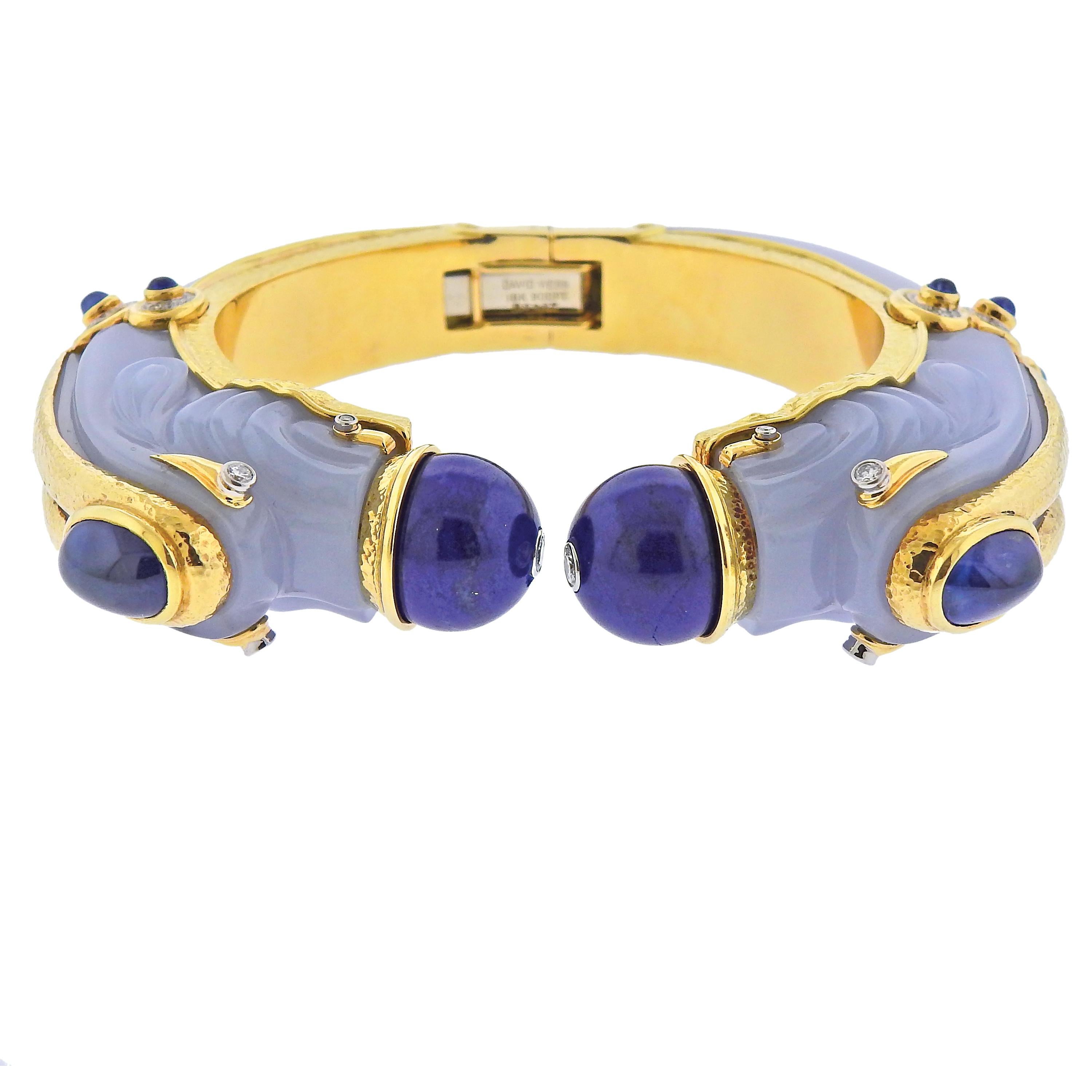 Impressive 18k gold and platinum Chimera bracelet by David Webb, with carved chalcedony, lapis lazuli, sapphires and approx. 0.30cts in H/VS-SI1 diamonds.   Cuff will fit approx. 7-7.25