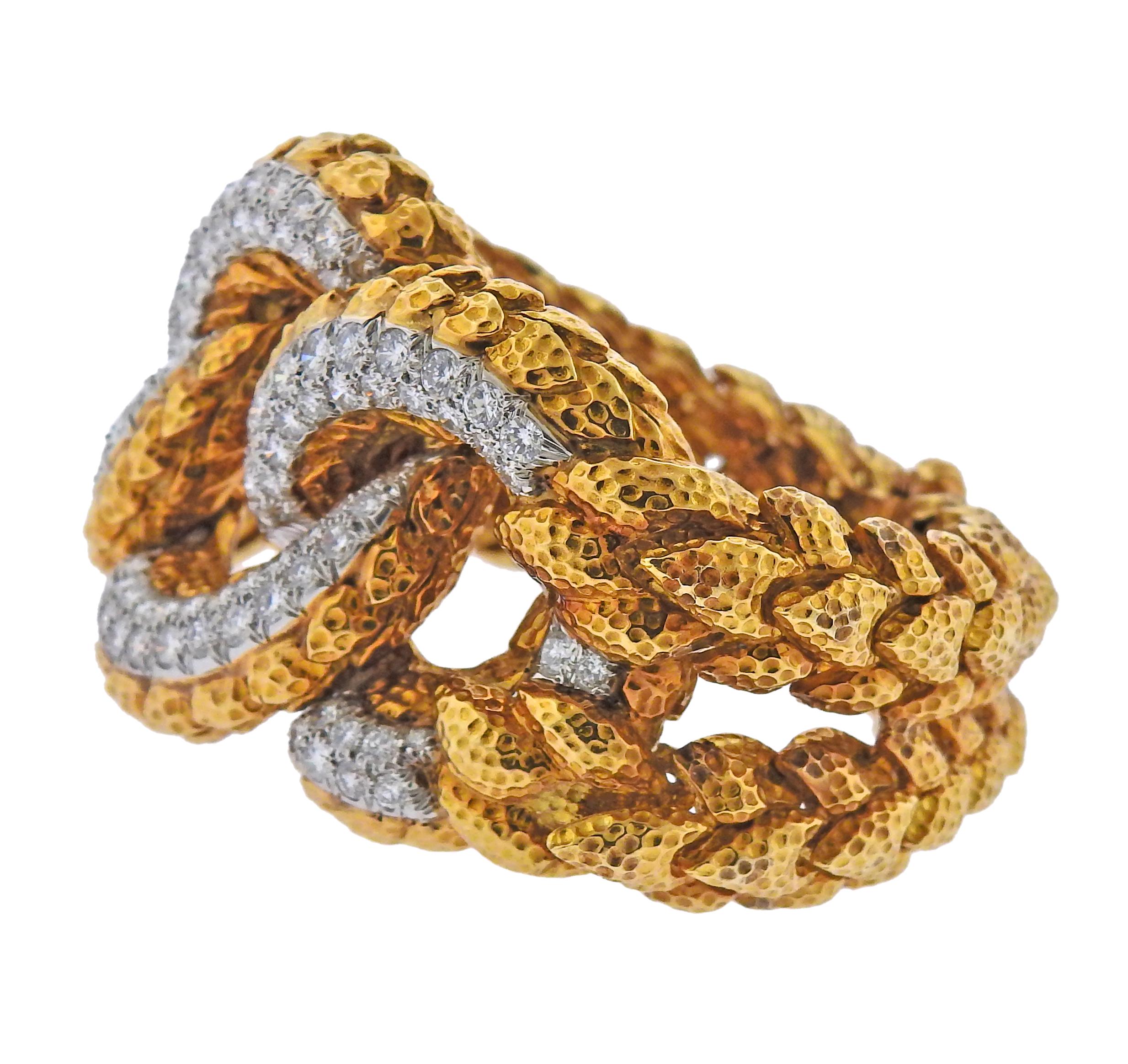 Iconic 18k hammered gold and platinum vintage link bracelet by David Webb, with approx. 5.50ctw in SI1/H diamonds. Original patina is present.  Bracelet fits up to 6 1/2