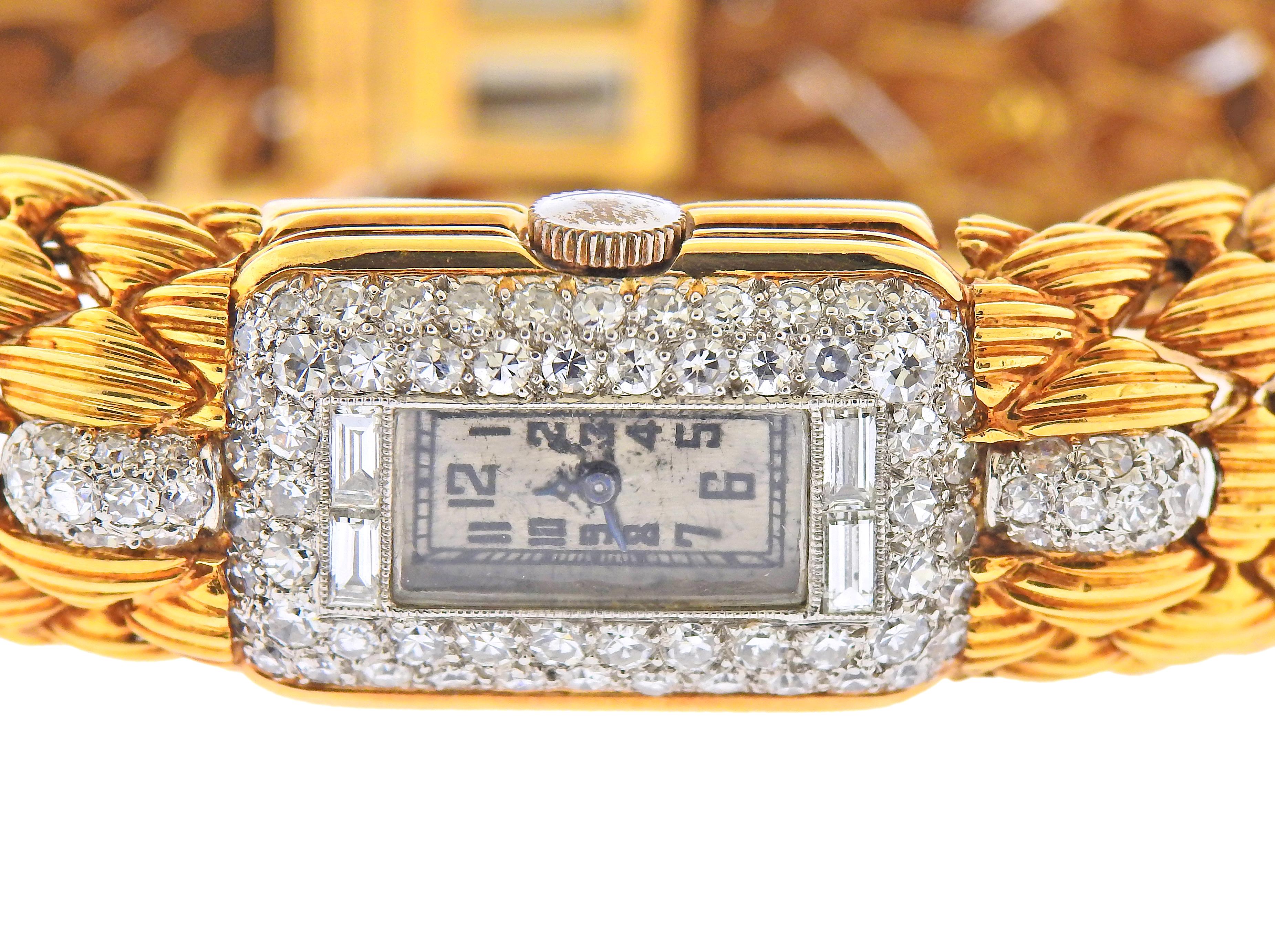 18k yellow gold bracelet with watch, case surrounded with approx. 0.80ctw in diamonds. Bracelet will fit up to 6.75