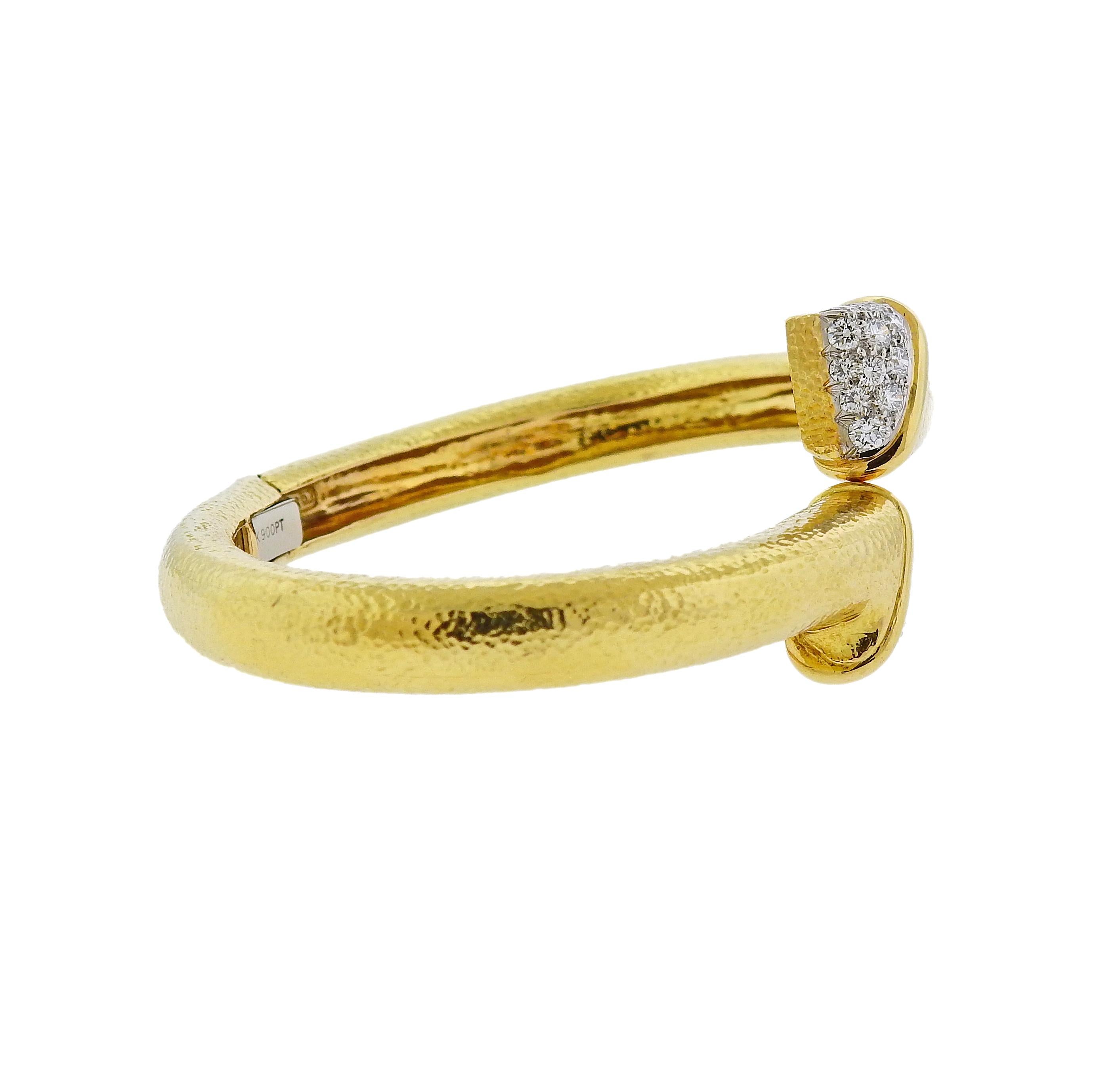 18k yellow gold and platinum crossover bangle bracelet, crafted by David Webb, adorned with approx. 1.40ctw in H/VS-SI diamonds. Retail $10800. Bracelet will fit up to 7