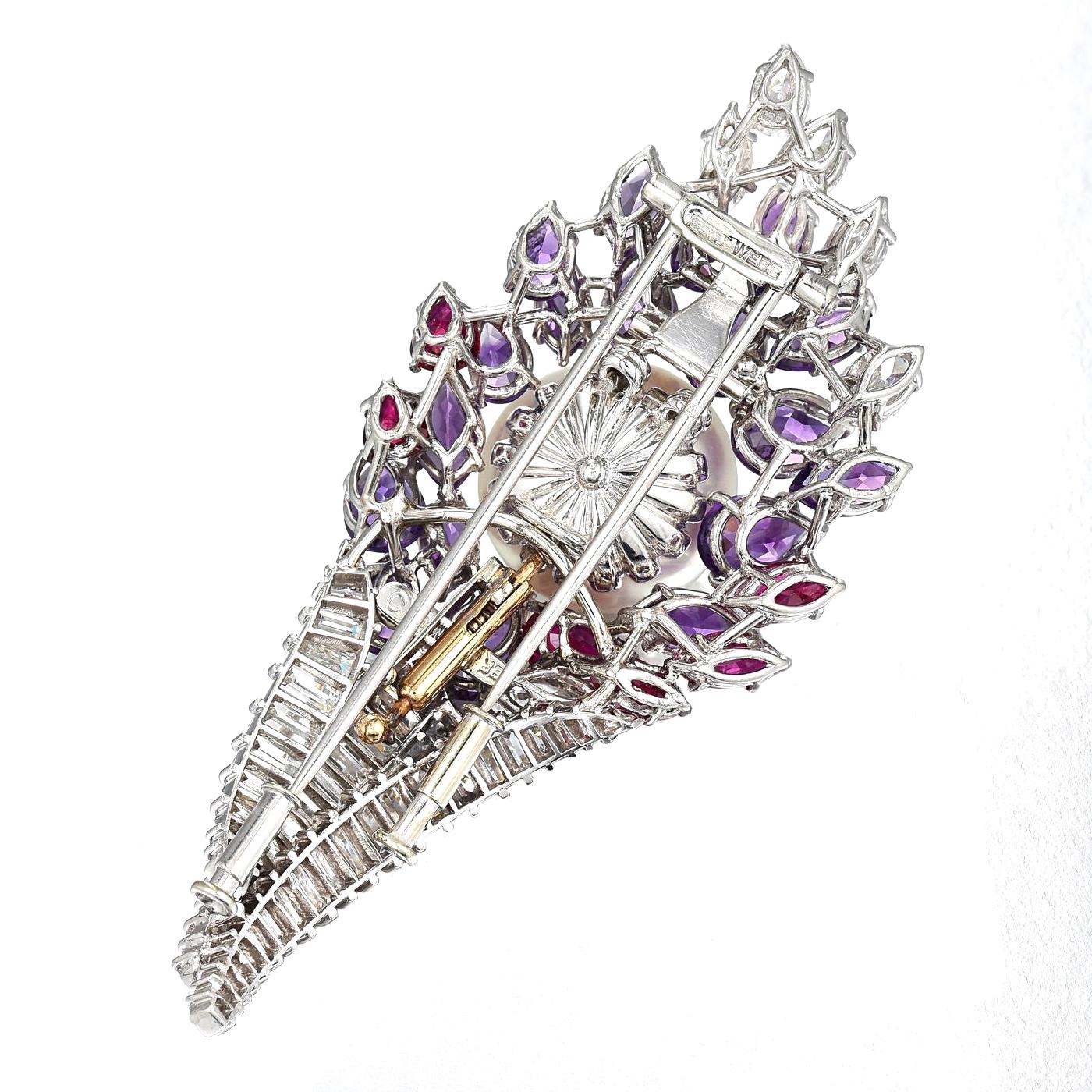 Crafted in platinum; set with baguette-, marquise- and pear brilliant-cut diamonds, weighing a total of approximately 6.30 carats, most with F-G color and VS clarity; accented by pear- and marquise-cut amethysts and rubies; button-shaped cultured