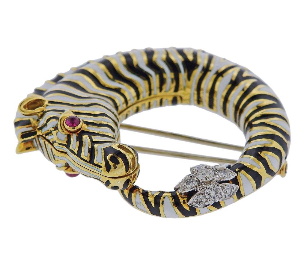 18k yellow gold and platinum zebra brooch by David Webb, set with enamel, ruby eye and approx. 0.45ctw in H/VS diamonds. Retail $28600. Brooch is 51mm x 45mm. Weight is 51.8 grams. Marked David Webb, 18k,  AA107. 