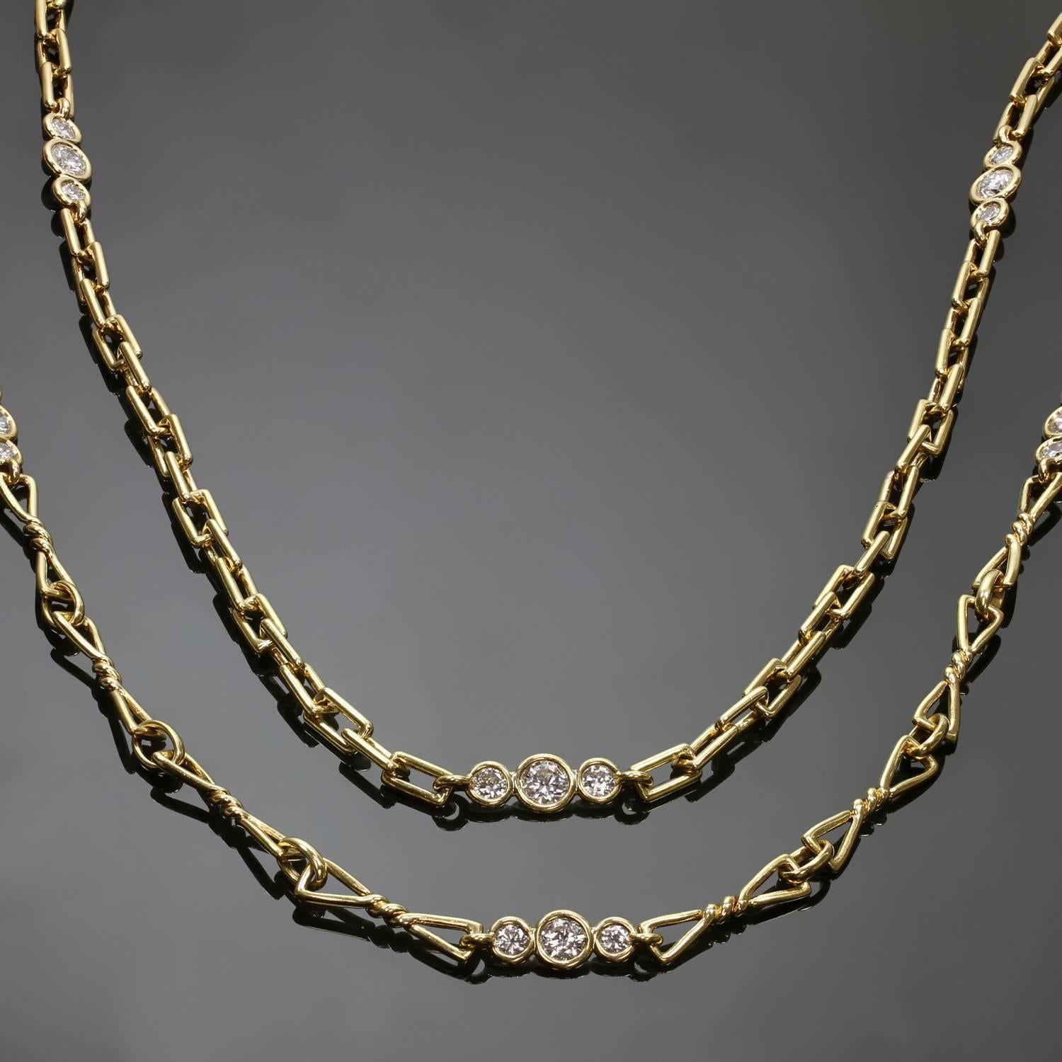 This chic and rare pair of long David Webb chains features a multi-shaped link design crafted in 18k yellow gold and accented with brilliant-cut round diamonds of an estimated 5.0 carats. Made in United States circa 1990s. Measurements: 28