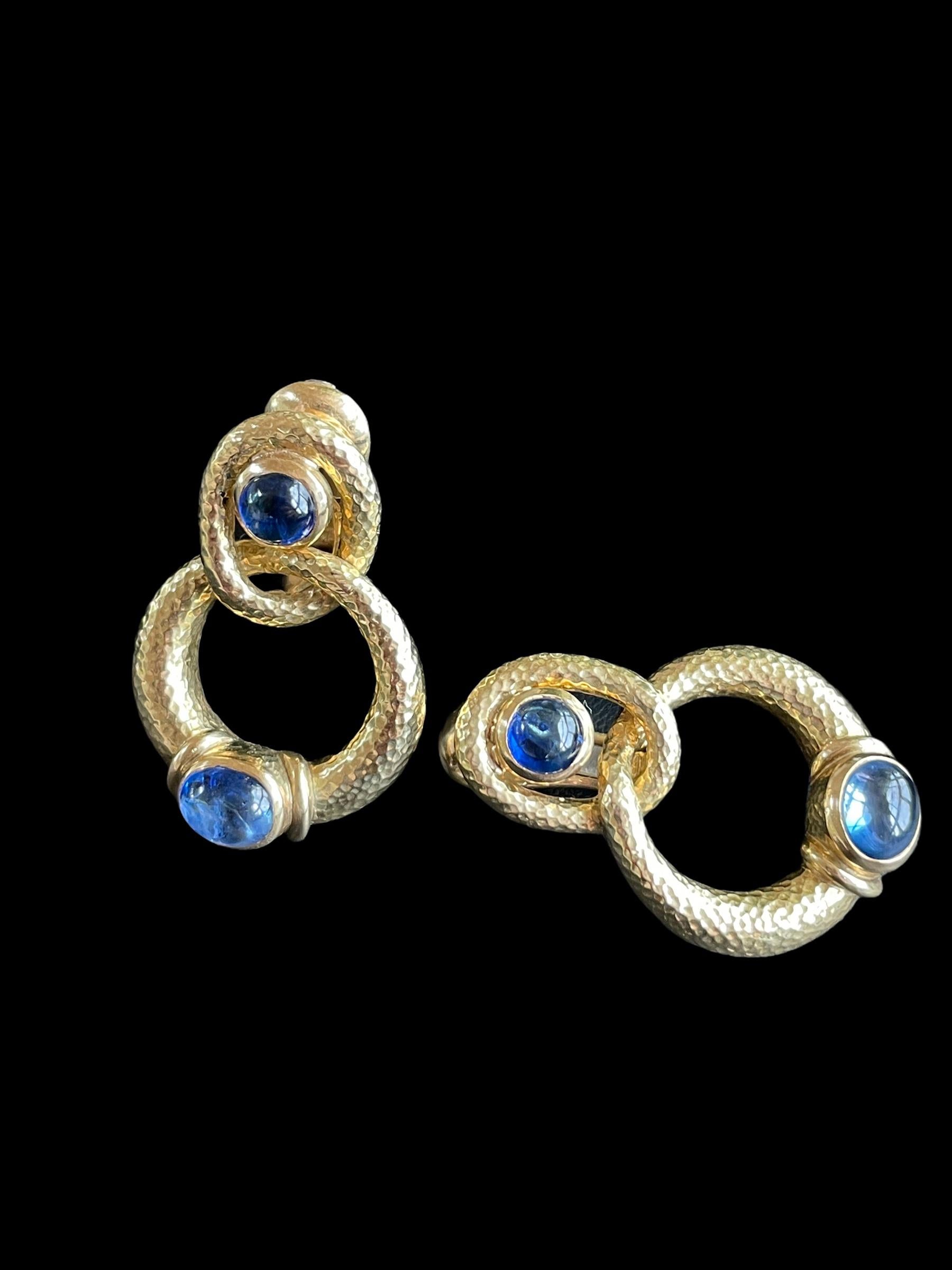 Classic wearable David Webb double hoop earrings accented with a cabochon sapphire. Each earring as a post with omega back. Very comfortable and easy to wear with any outfit.

Stamped Webb 18k
