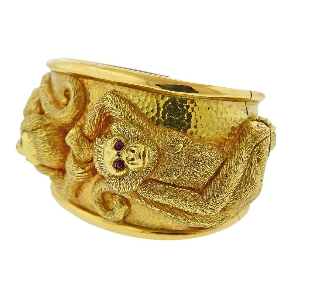 18k gold cuff bracelet, depicting two monkeys with ruby eyes. Crafted by David Webb. Bracelet will fit approx. 6 to 6.5