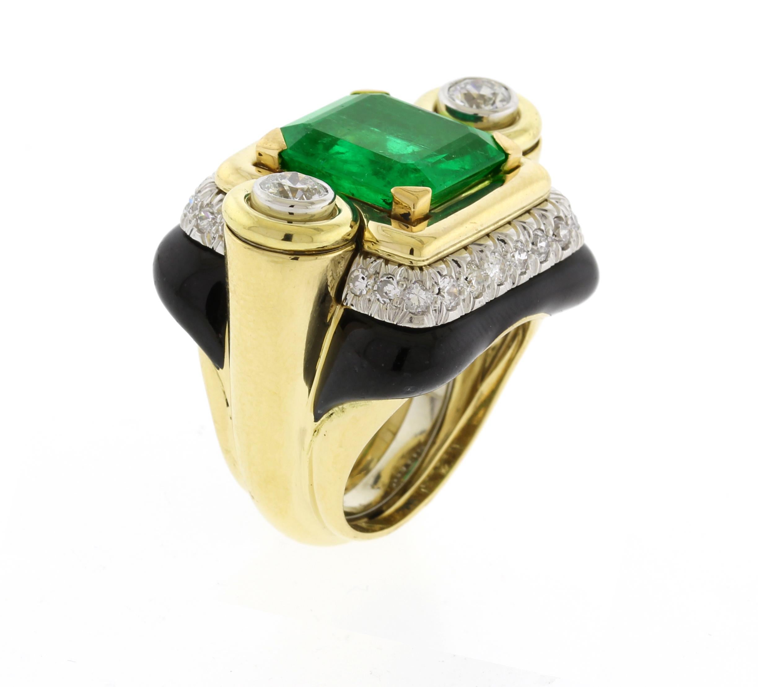 From David Webb, a beautiful emerald ring with diamonds and black enamel.  The ring does have a U guard in it.
• Designer: David Webb
• Metal: 18 karat gold
• Circa: 1980s
• Size: 5, cannot be resized 
• Gemstones: Emerald and Diamonds
• Weight: