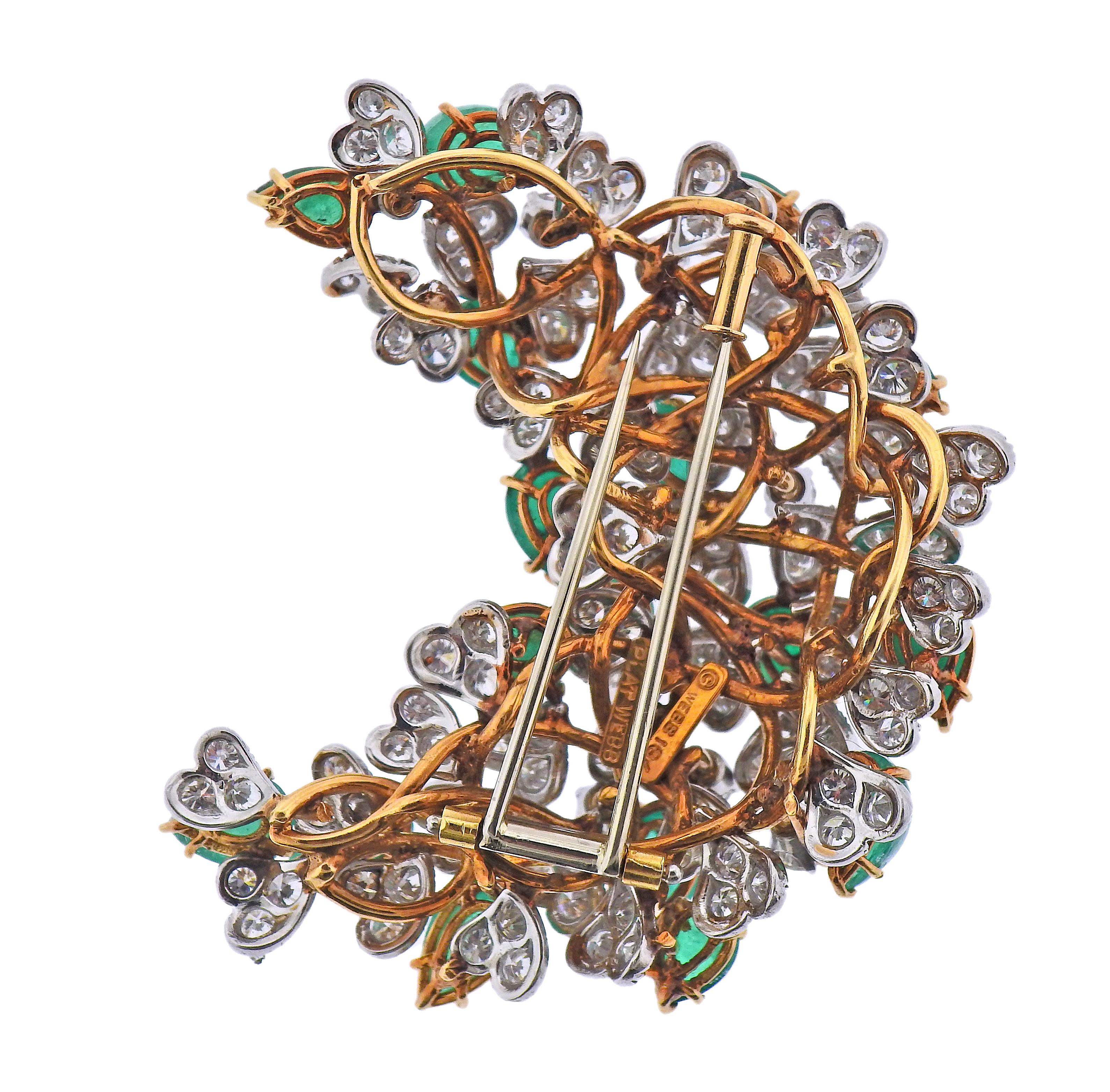 David Webb 18k yellow gold and platinum brooch, decorated with pear shaped emerald cabochons (17 stones), surrounded with approx. 7 carats in diamonds. Brooch measures 2