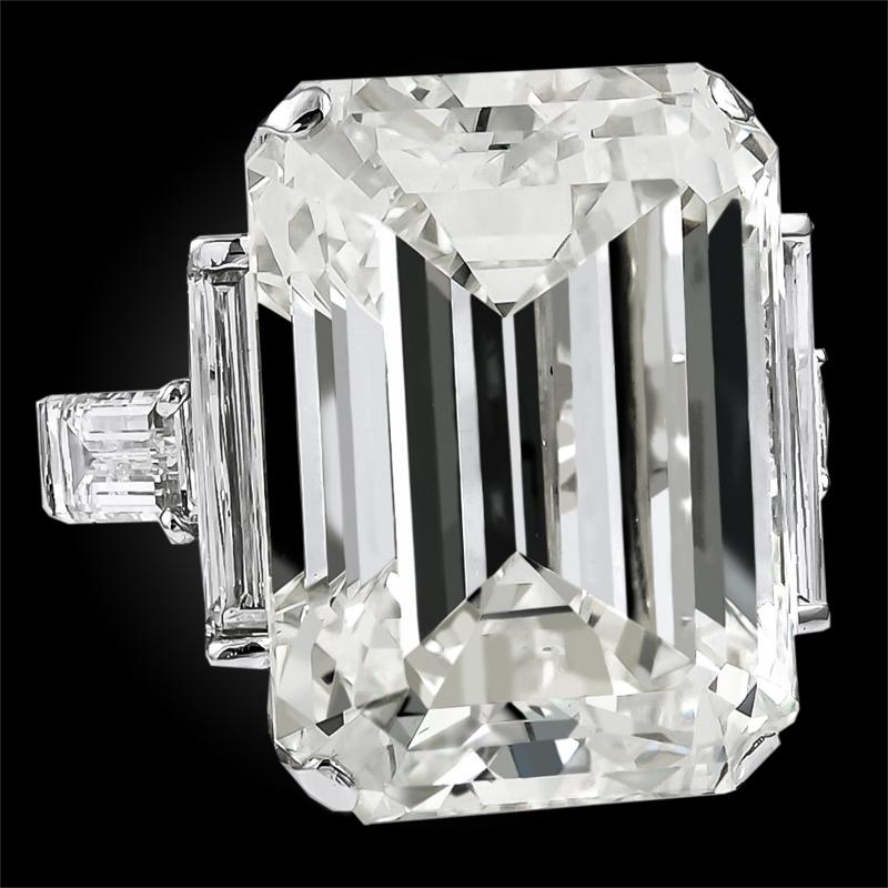 Throughout centuries, diamonds have represented permanence, luxury, and strength. This remarkable David Webb ring exudes all of that and more with its remarkable center emerald cut diamond weighing a total of 52.55 carats surrounded by 4 baguette