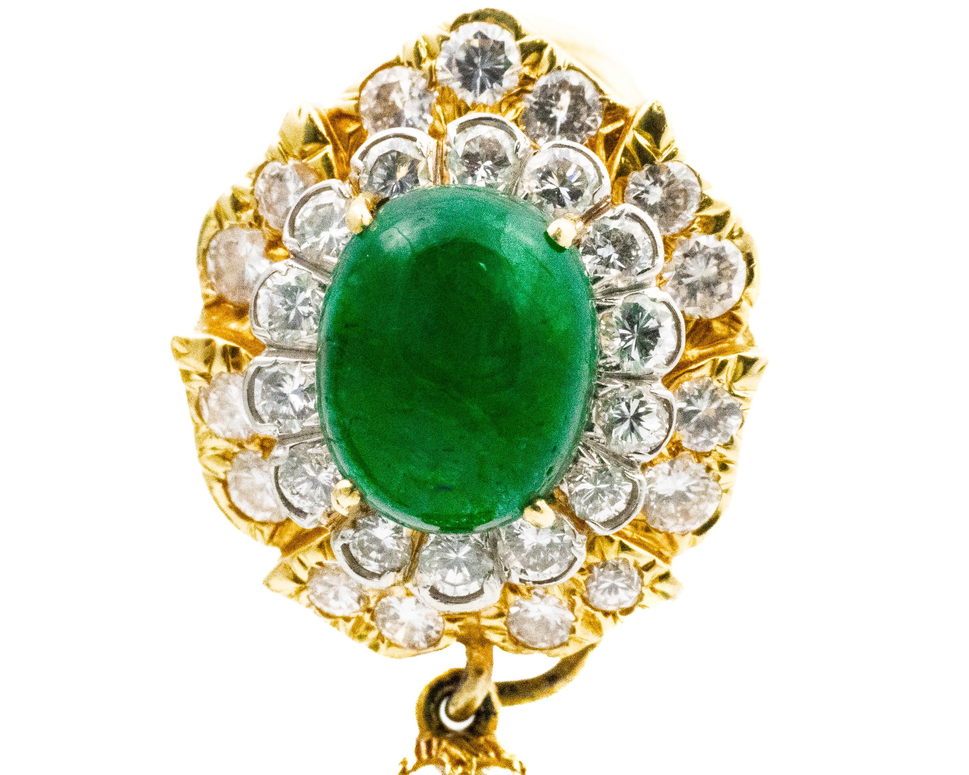 David Webb Emerald & Diamond Pendent Earrings

A breathtaking pair of David Webb 2 in 1 earrings crafted in 18k yellow gold and featuring a bold, elegant design. These earrings are adorned with vibrant emeralds in both oval and pear-cut forms, .The