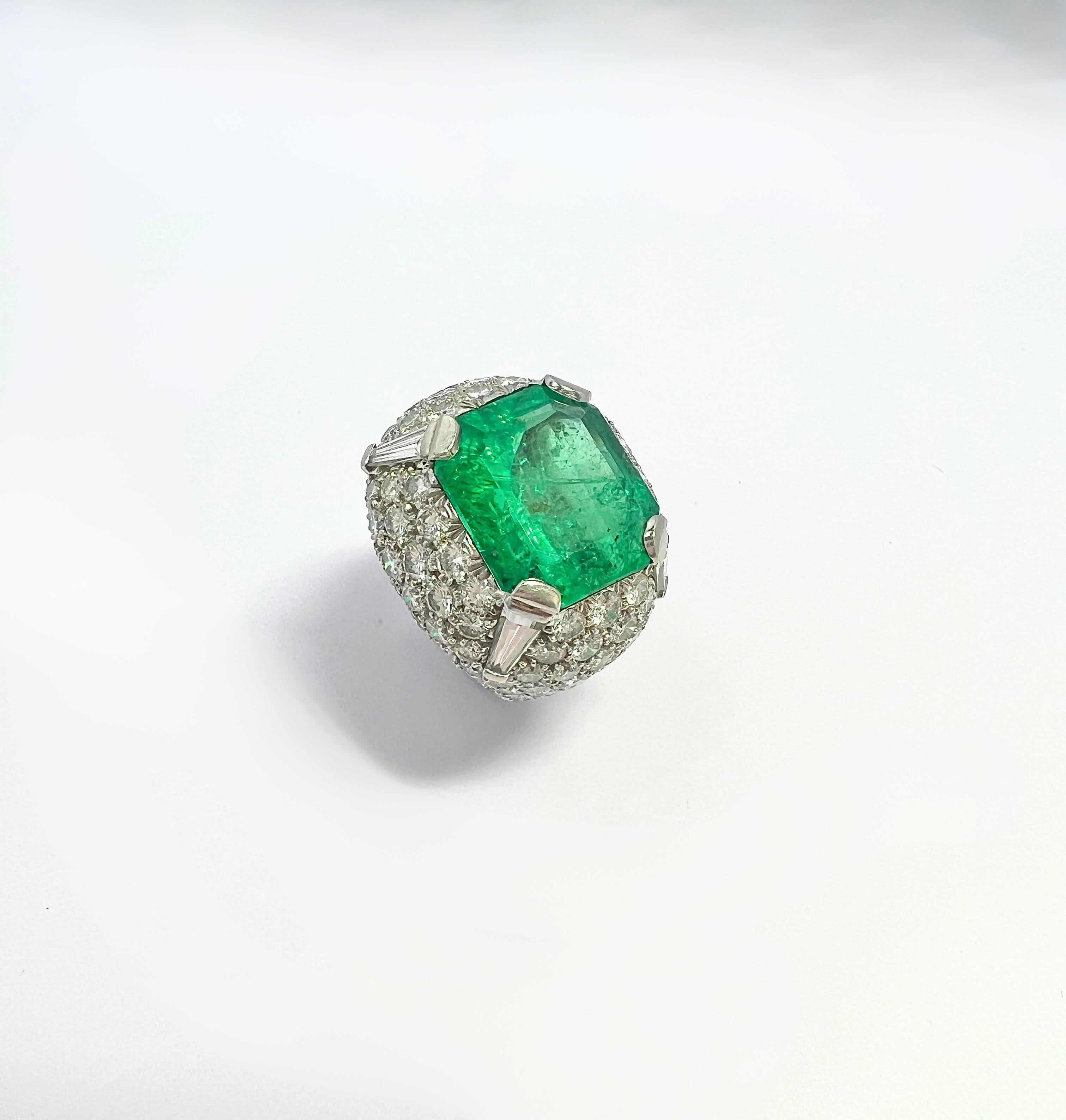 David Webb Emerald Diamond Ring

Approx. 15 carats of emerald, and 10 carats of diamonds, Platinum. Weight 23.0 grams, Ring size approx. 4.75-5 (US size), 15.55mm in diameter. 
Hallmarked: 