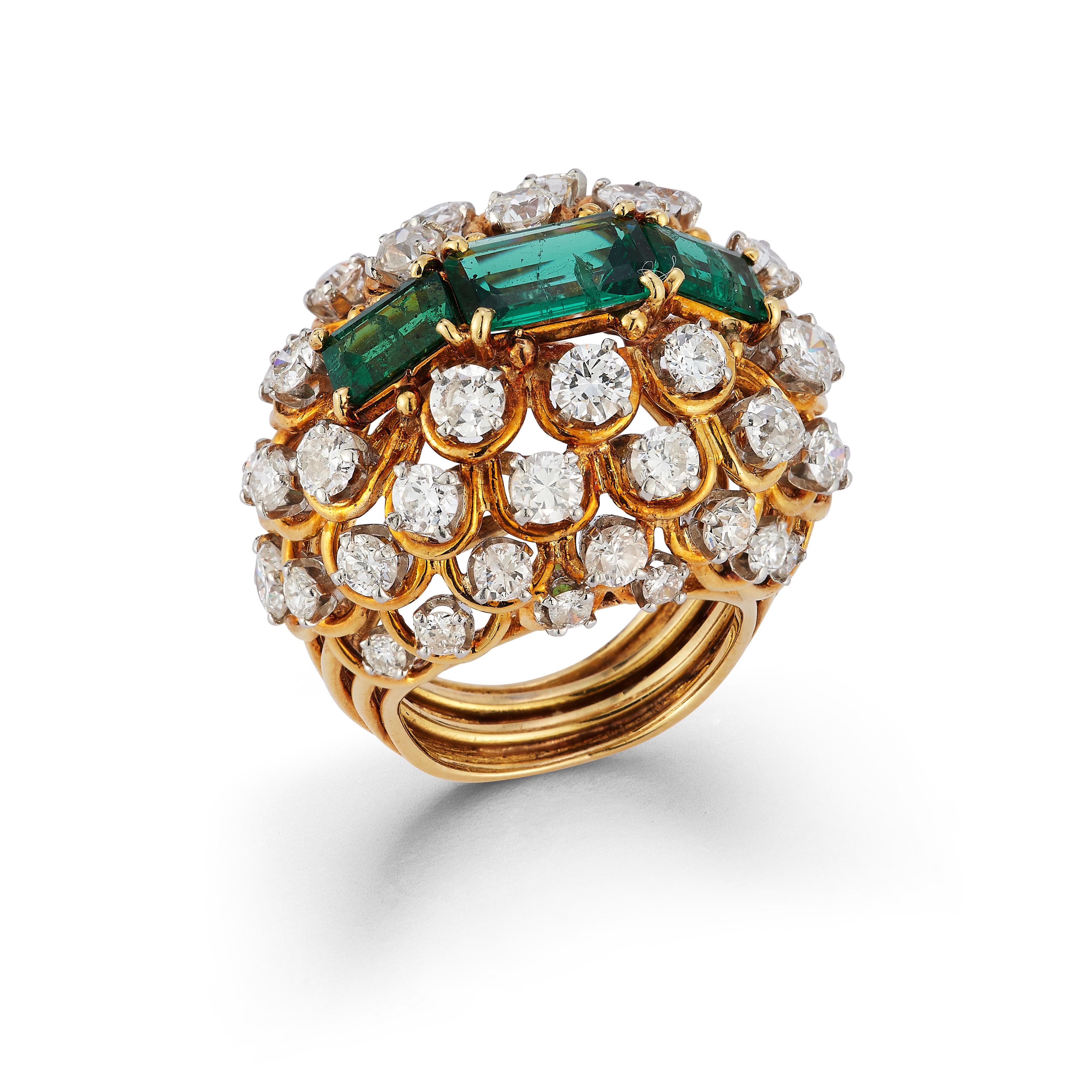 David Webb Emerald & Diamond Ring

An 18 karat gold and platinum ring set with 3 baguette cut emeralds in a cluster of round cut diamonds 

Signed David Webb & numbered
Stamped 18k & platinum

Ring Size: 5.25
Resizable free of charge

Accompanied