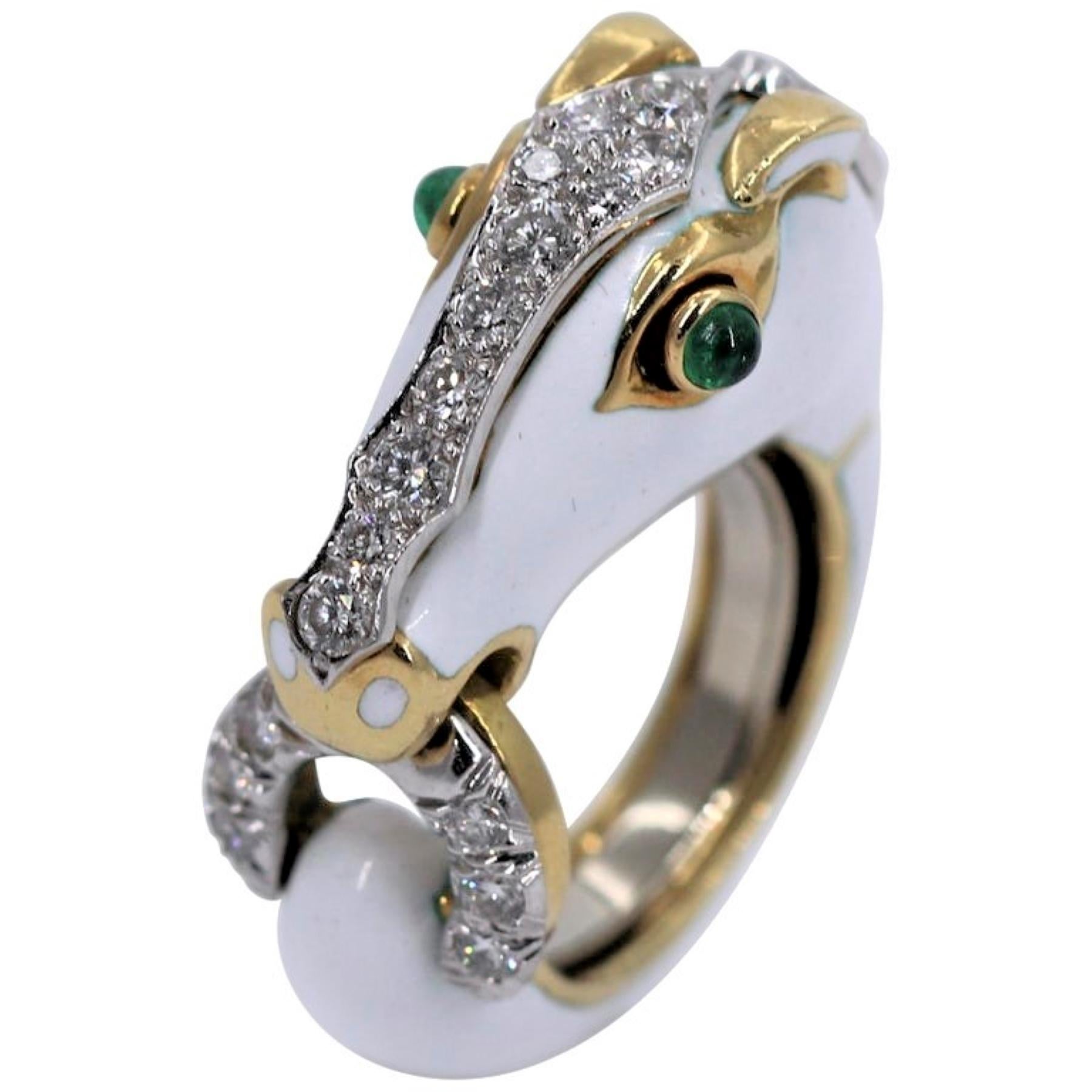 One of the classic animal designs of David Webb this horse is brought to life through the use of 18 karat yellow gold, platinum, diamonds, emeralds, and enamel. Set with a assorted round brilliant cut diamonds weighing a total weight of