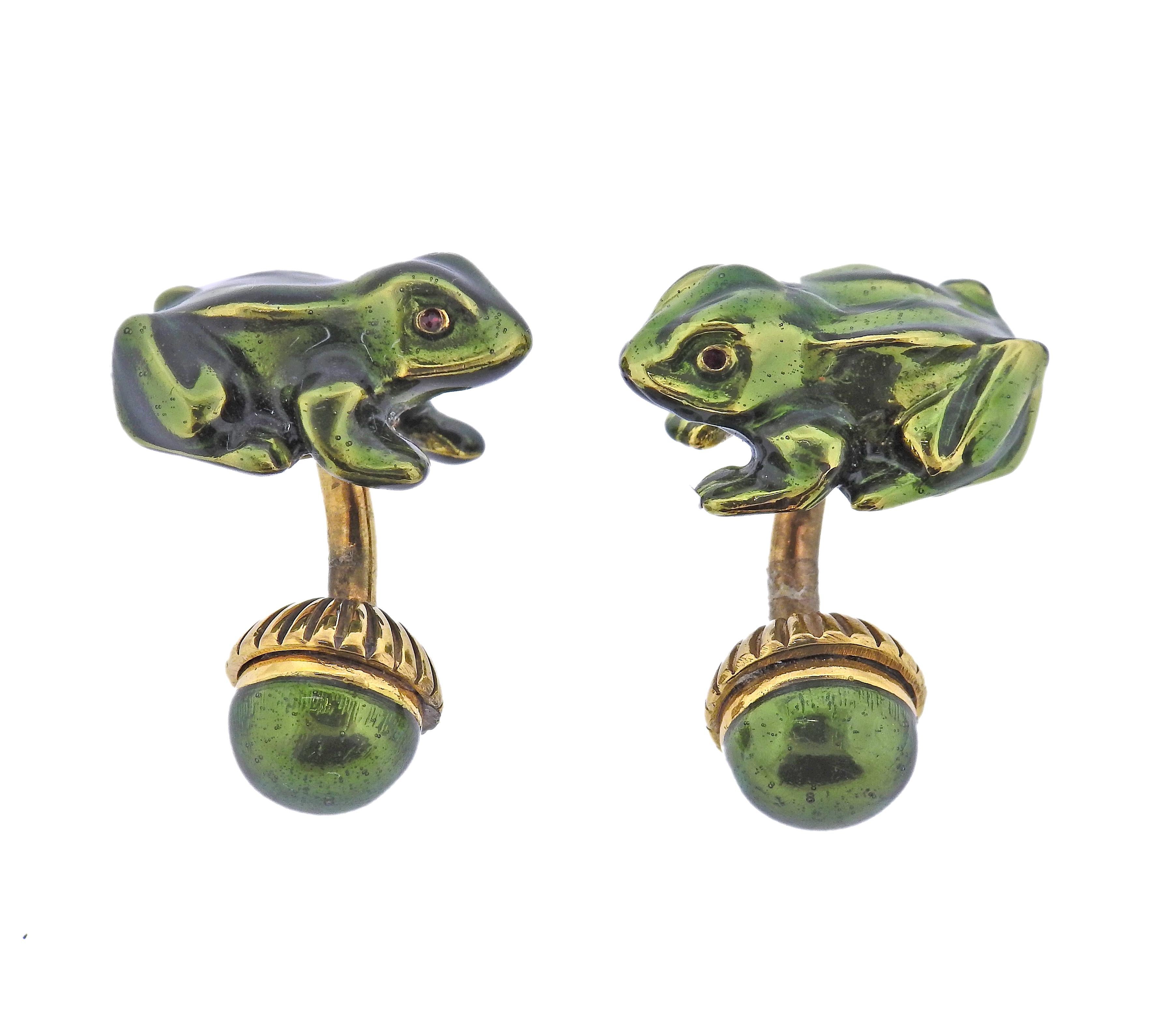 Pair of vintage 18k gold frog cufflinks by David Webb, adorned with red enamel eyes and green body. Come in original David Webb box. Each frog measures 22mm x 16mm, back ball is 11mm in diameter. Marked: Webb, 18k. Weight - 26.1 grams.